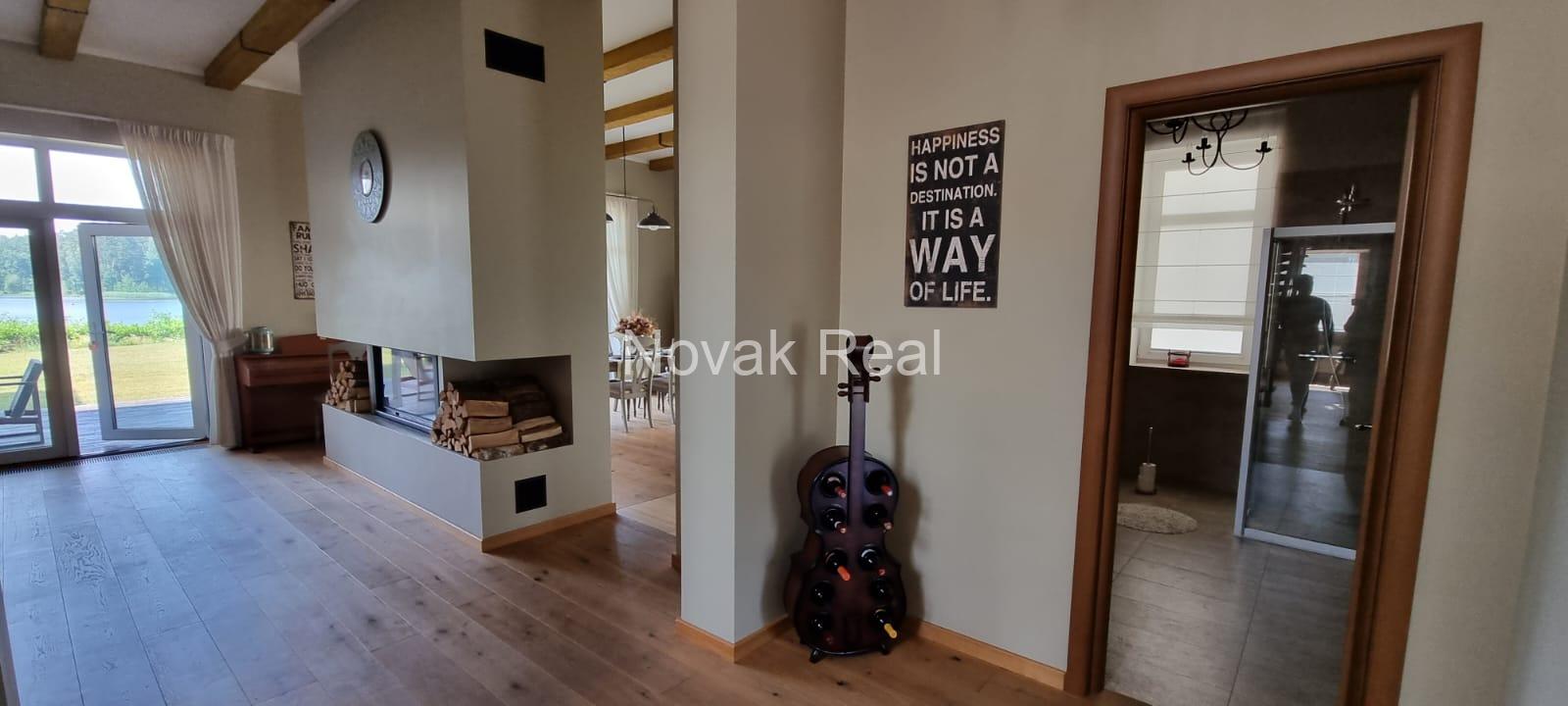 A beautiful house with 5 bedrooms is for sale in the elite gated community of Taureni, on the shore of the lake