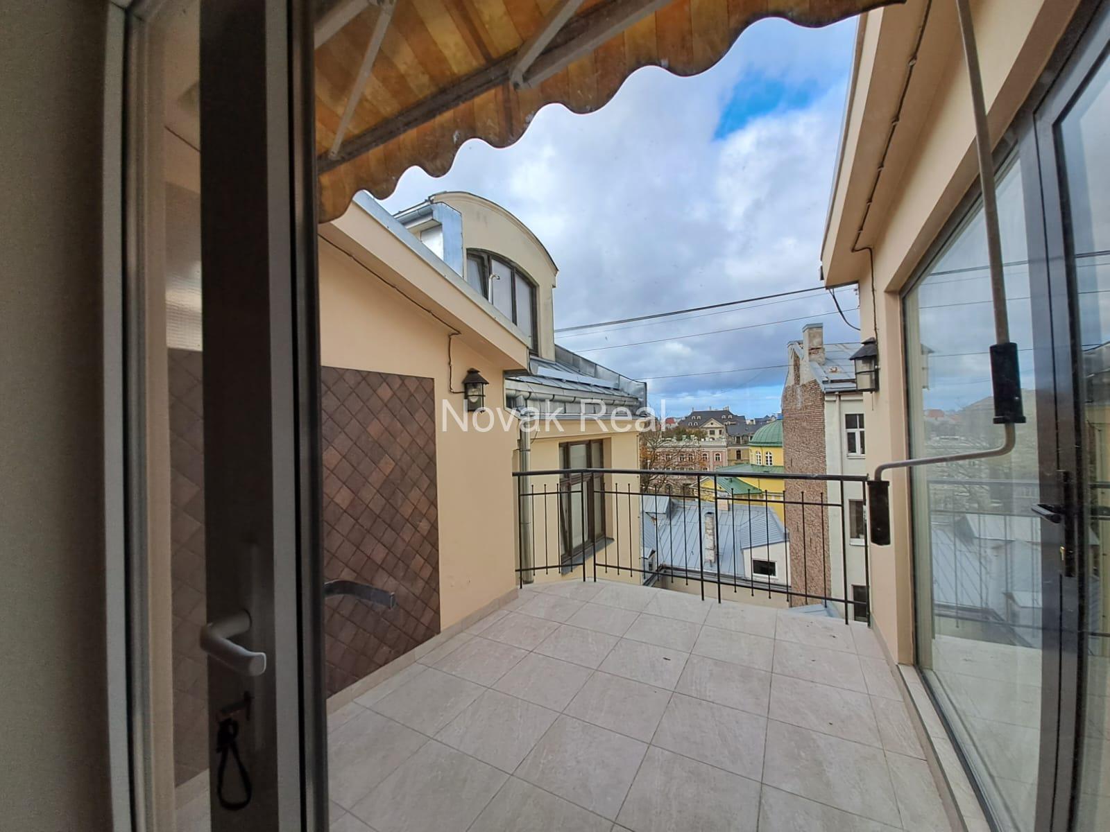 A cozy apartment with a terrace is available for rent in a beautiful building after full renovation
