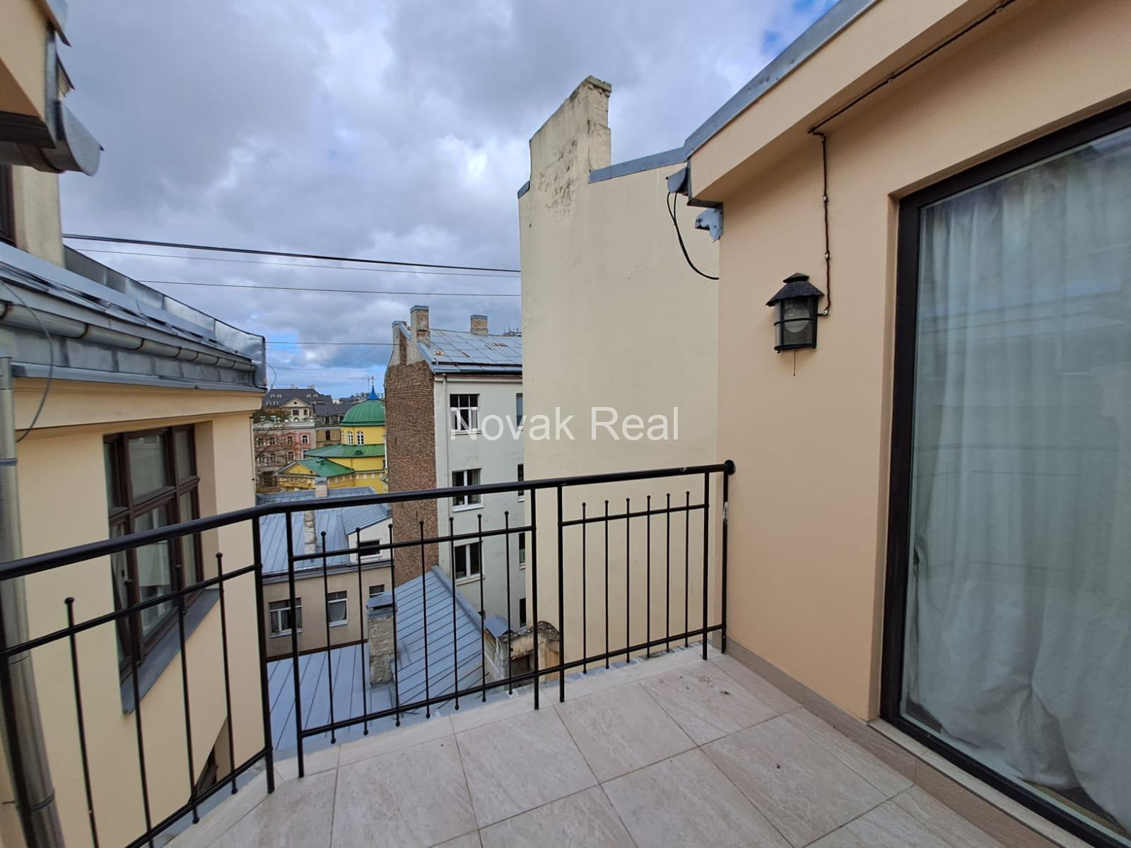 A cozy apartment with a terrace is available for rent in a beautiful building after full renovation