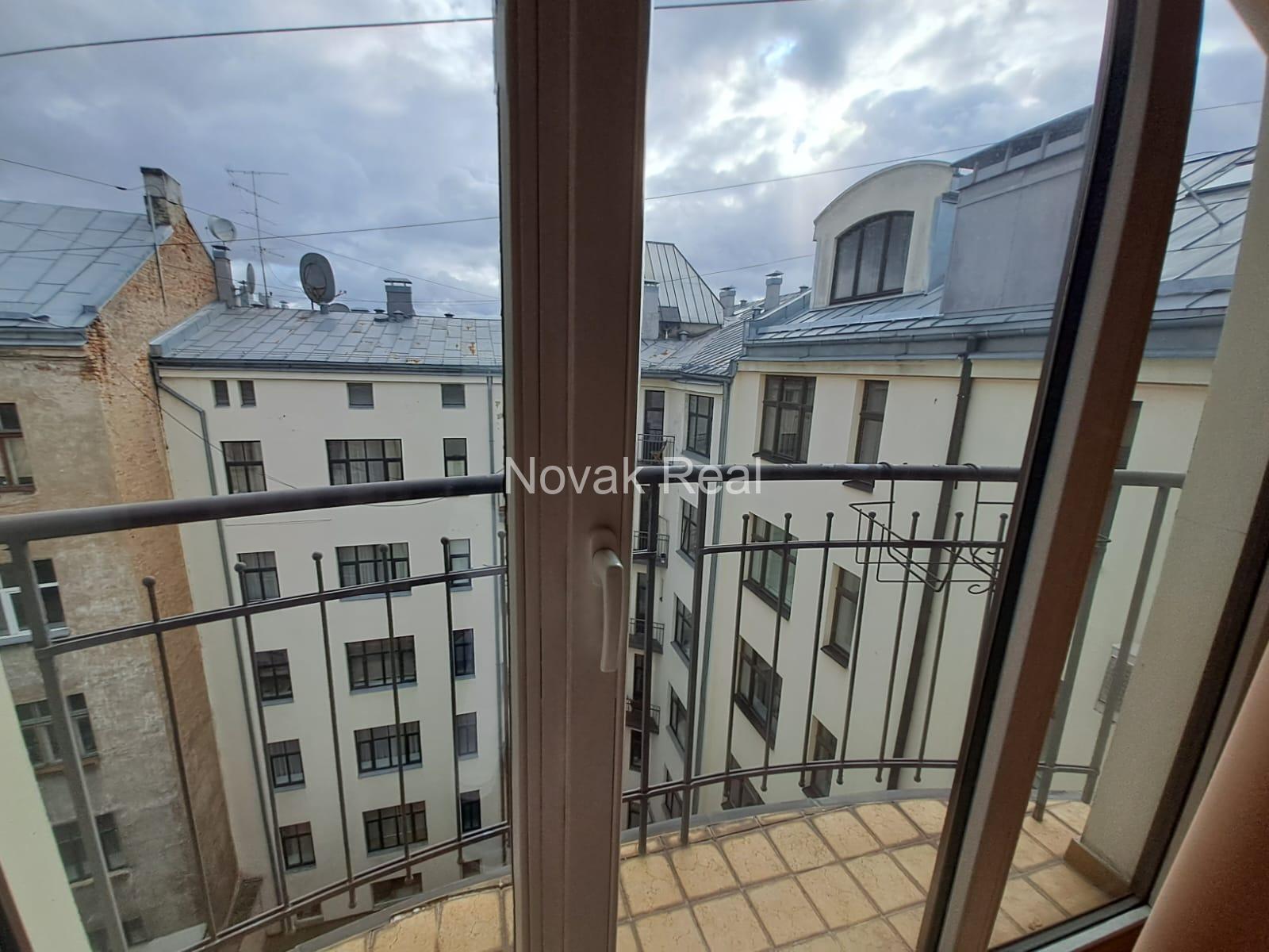 A cozy apartment with a terrace is available for rent in a beautiful building after full renovation