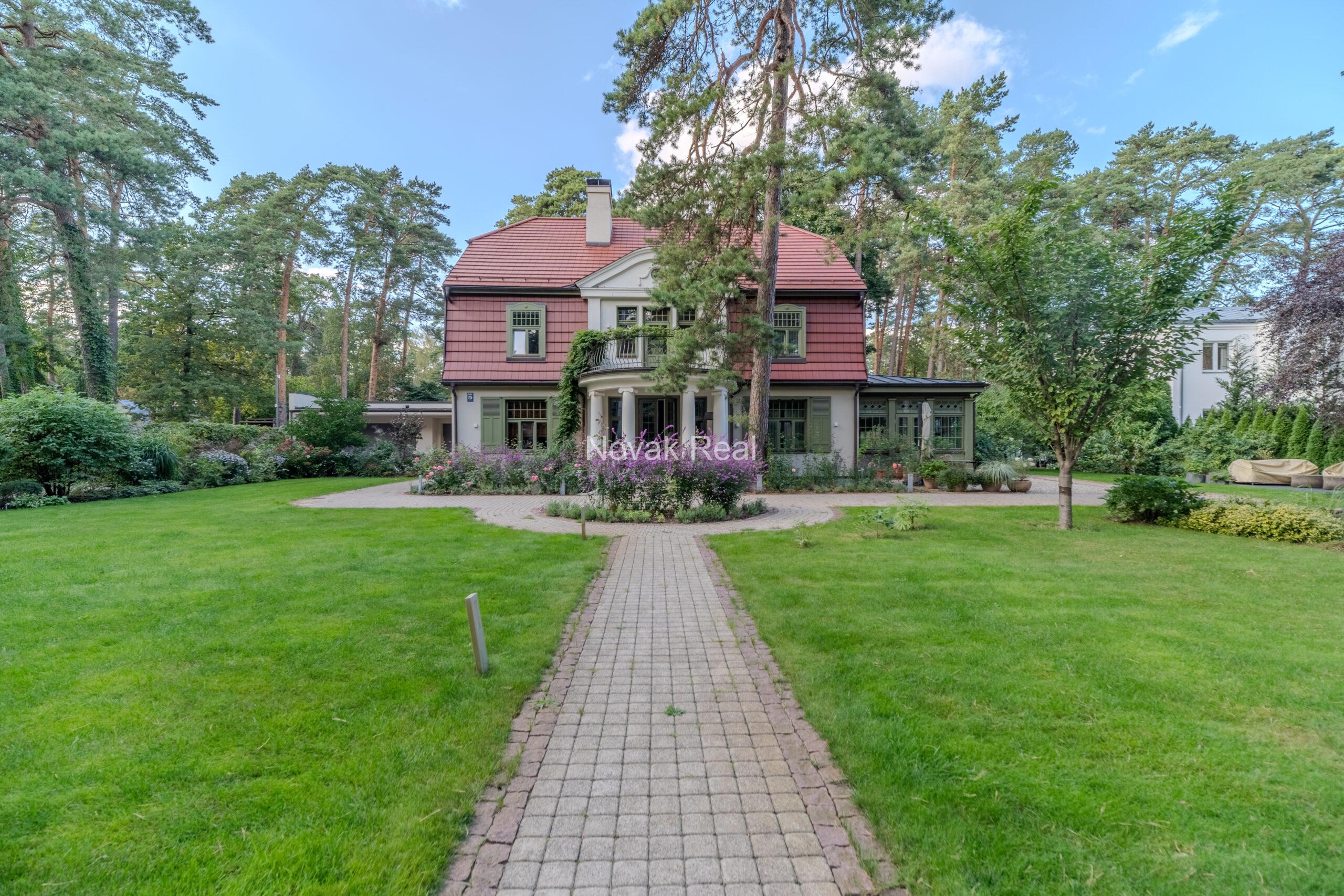 In Lielupe, close to the sea and a pine park, an elegant, renovated three-storey villa is offered for sale
