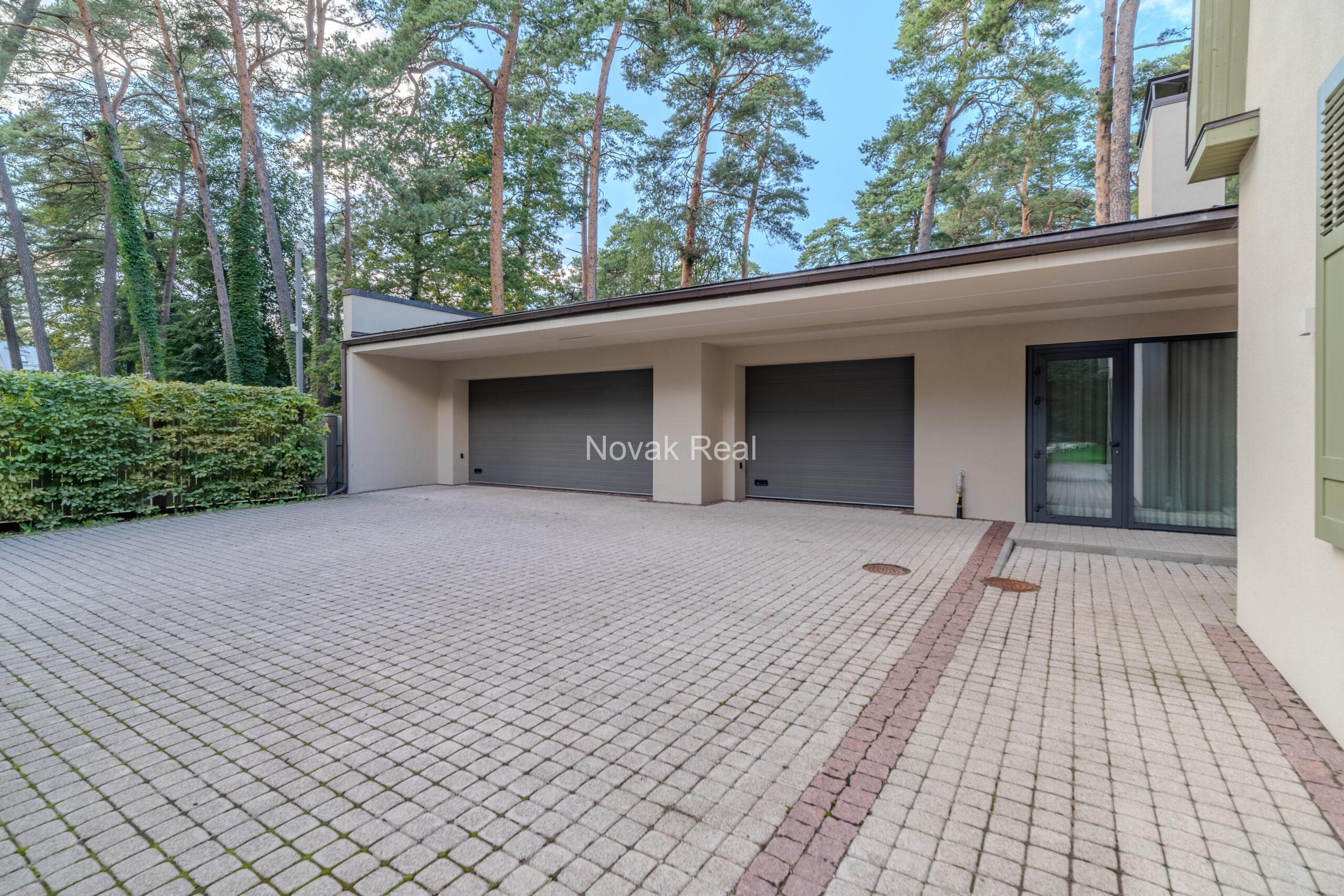 In Lielupe, close to the sea and a pine park, an elegant, renovated three-storey villa is offered for sale