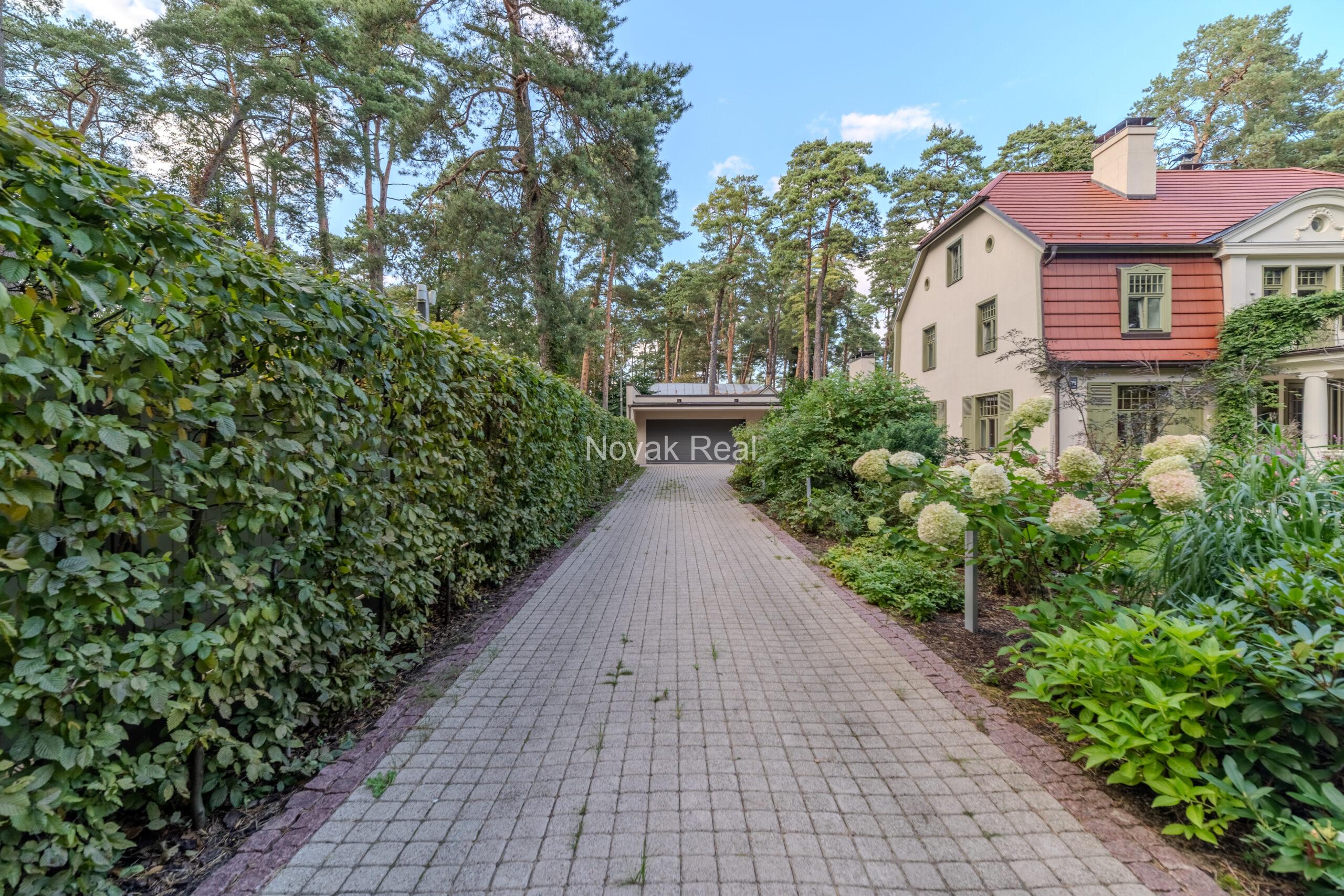 In Lielupe, close to the sea and a pine park, an elegant, renovated three-storey villa is offered for sale
