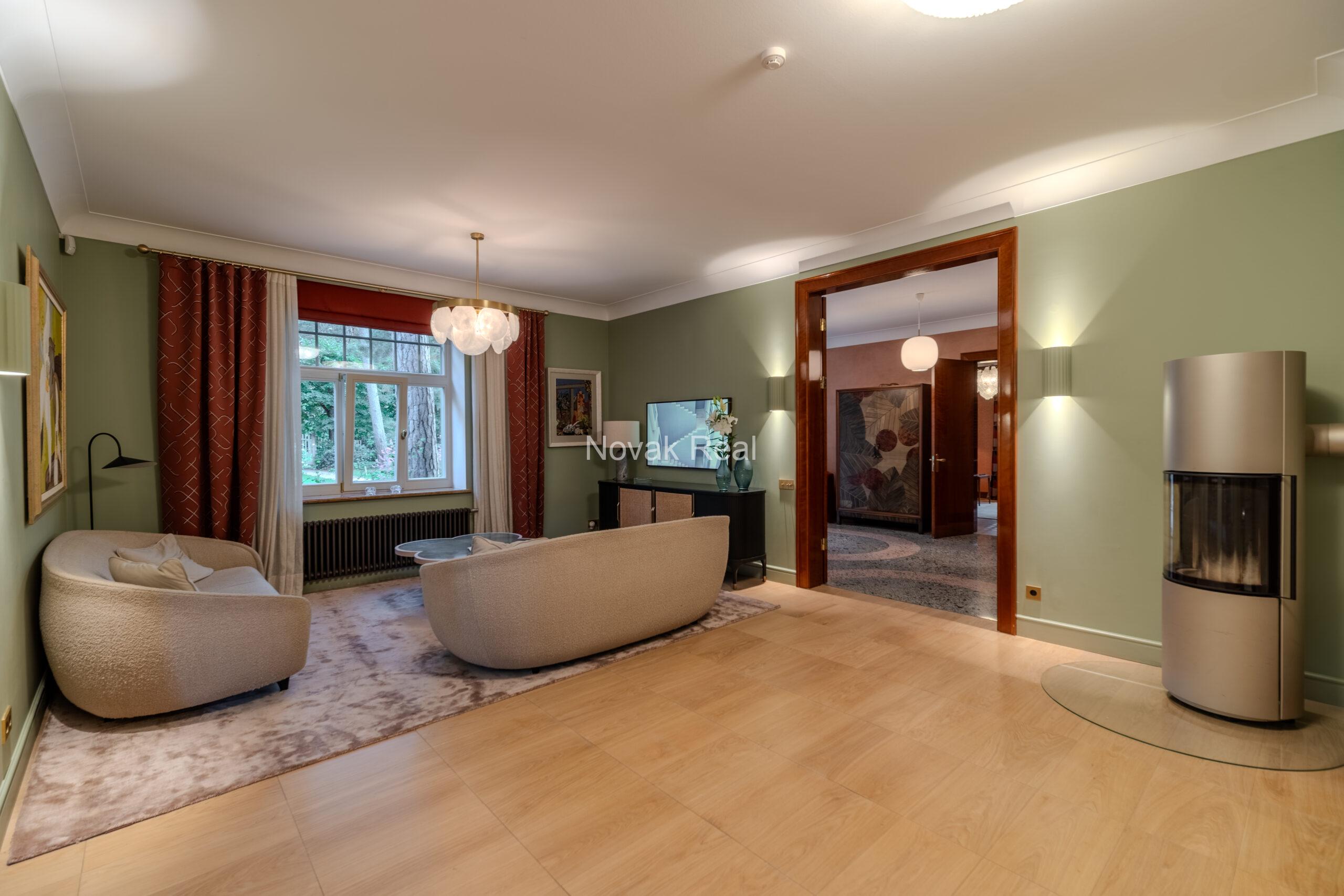 In Lielupe, close to the sea and a pine park, an elegant, renovated three-storey villa is offered for sale