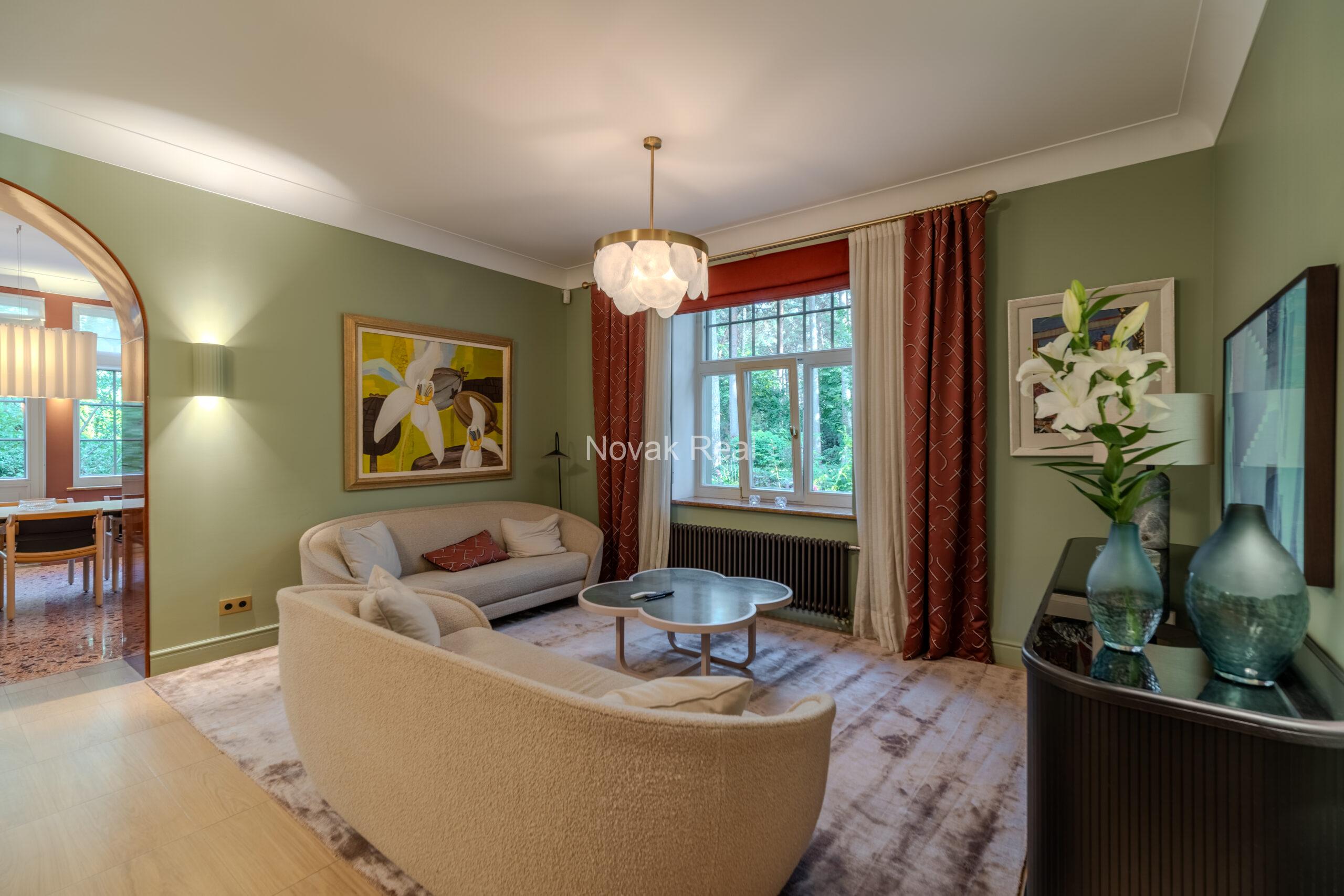 In Lielupe, close to the sea and a pine park, an elegant, renovated three-storey villa is offered for sale