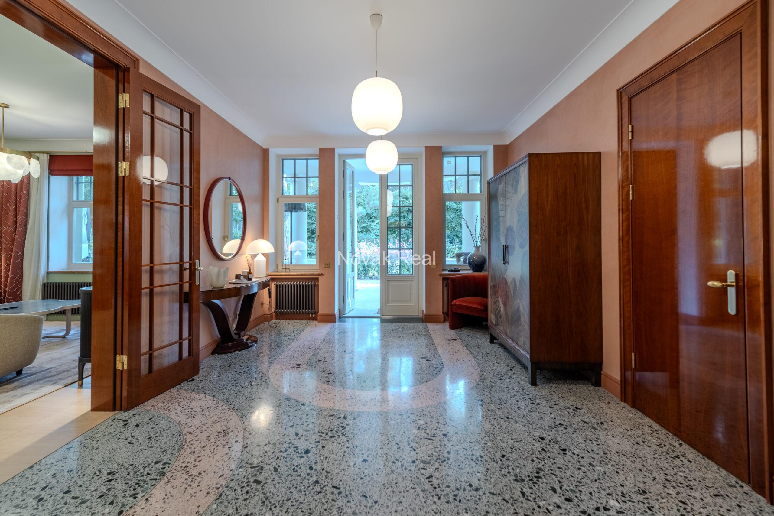 In Lielupe, close to the sea and a pine park, an elegant, renovated three-storey villa is offered for sale