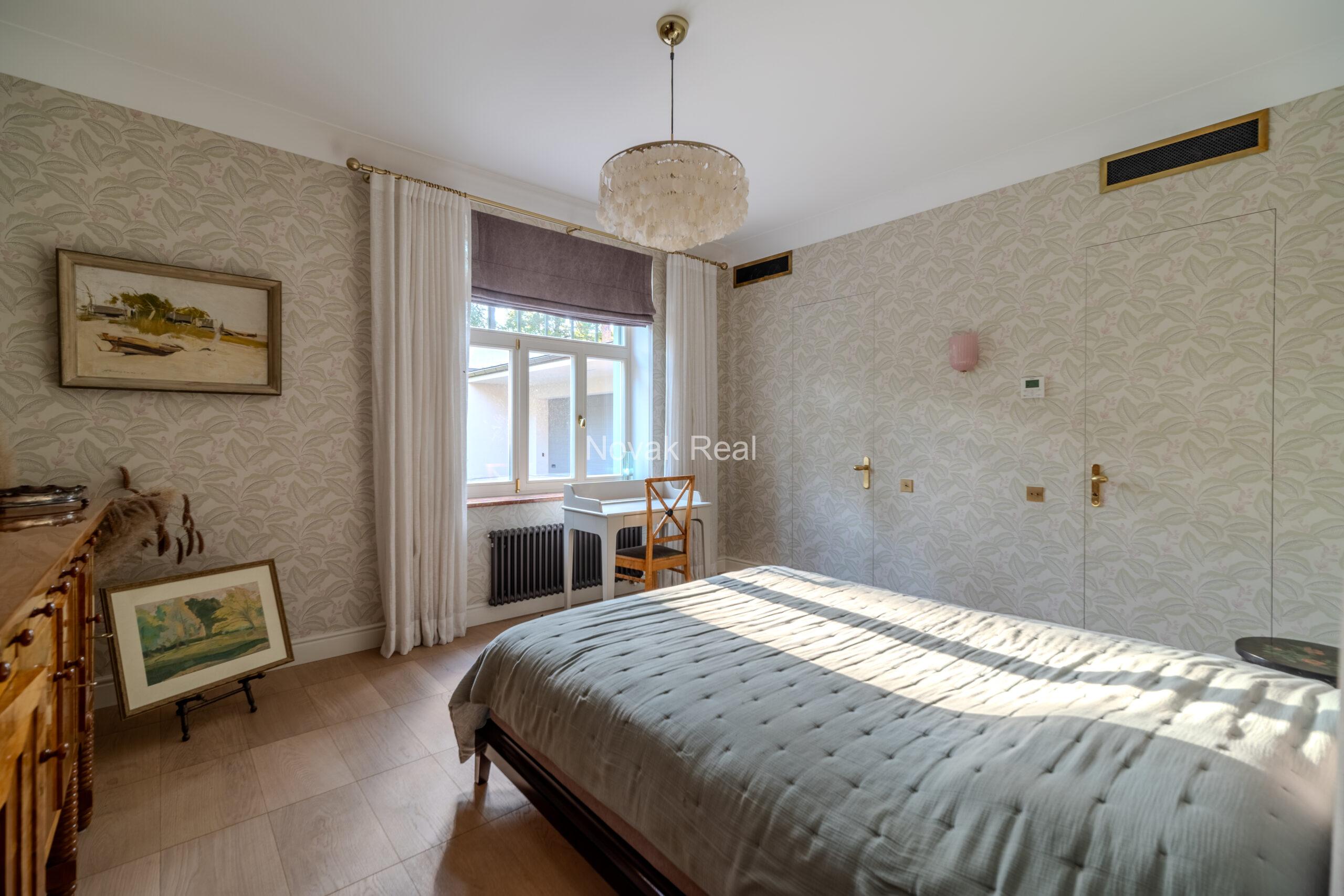 In Lielupe, close to the sea and a pine park, an elegant, renovated three-storey villa is offered for sale