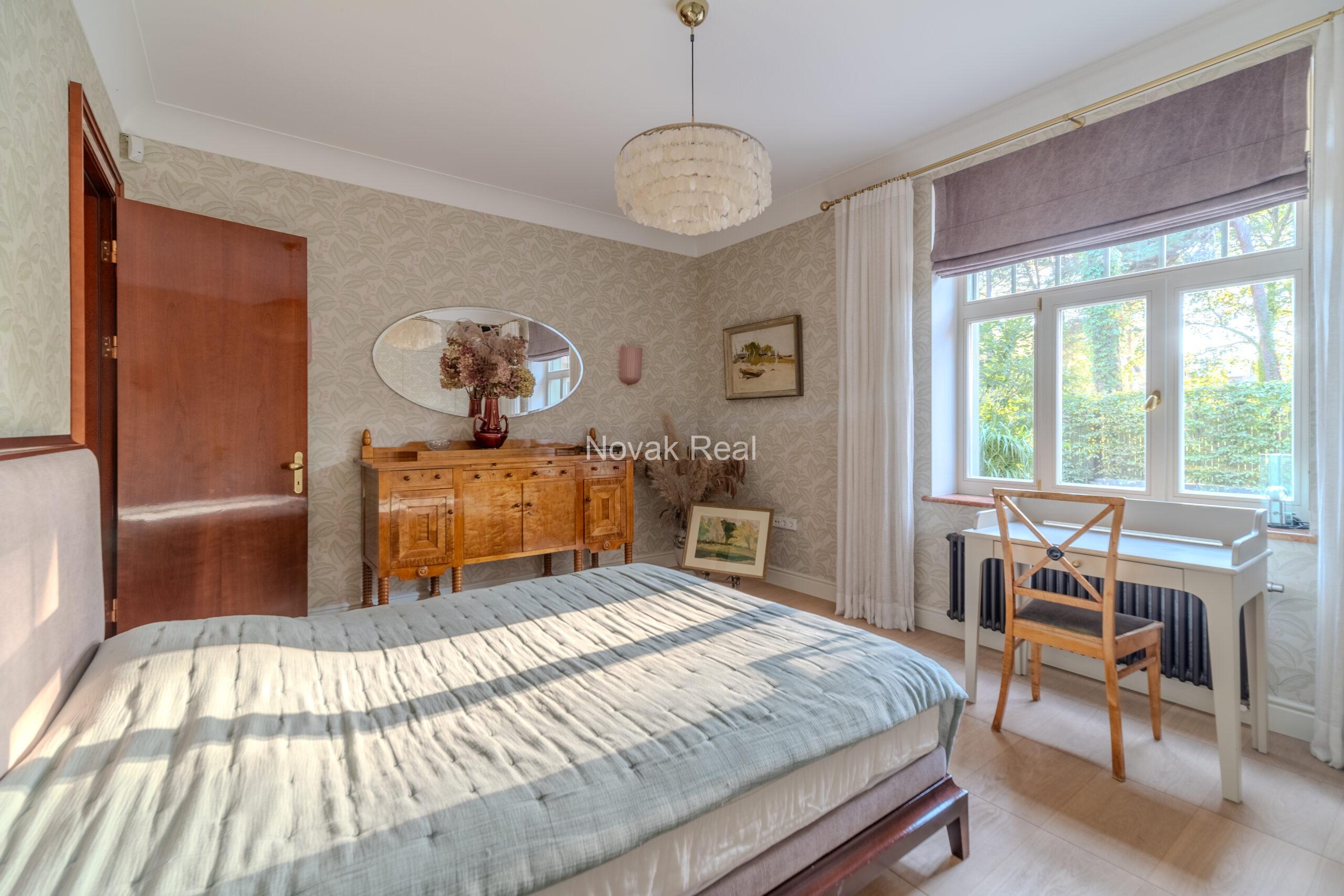 In Lielupe, close to the sea and a pine park, an elegant, renovated three-storey villa is offered for sale