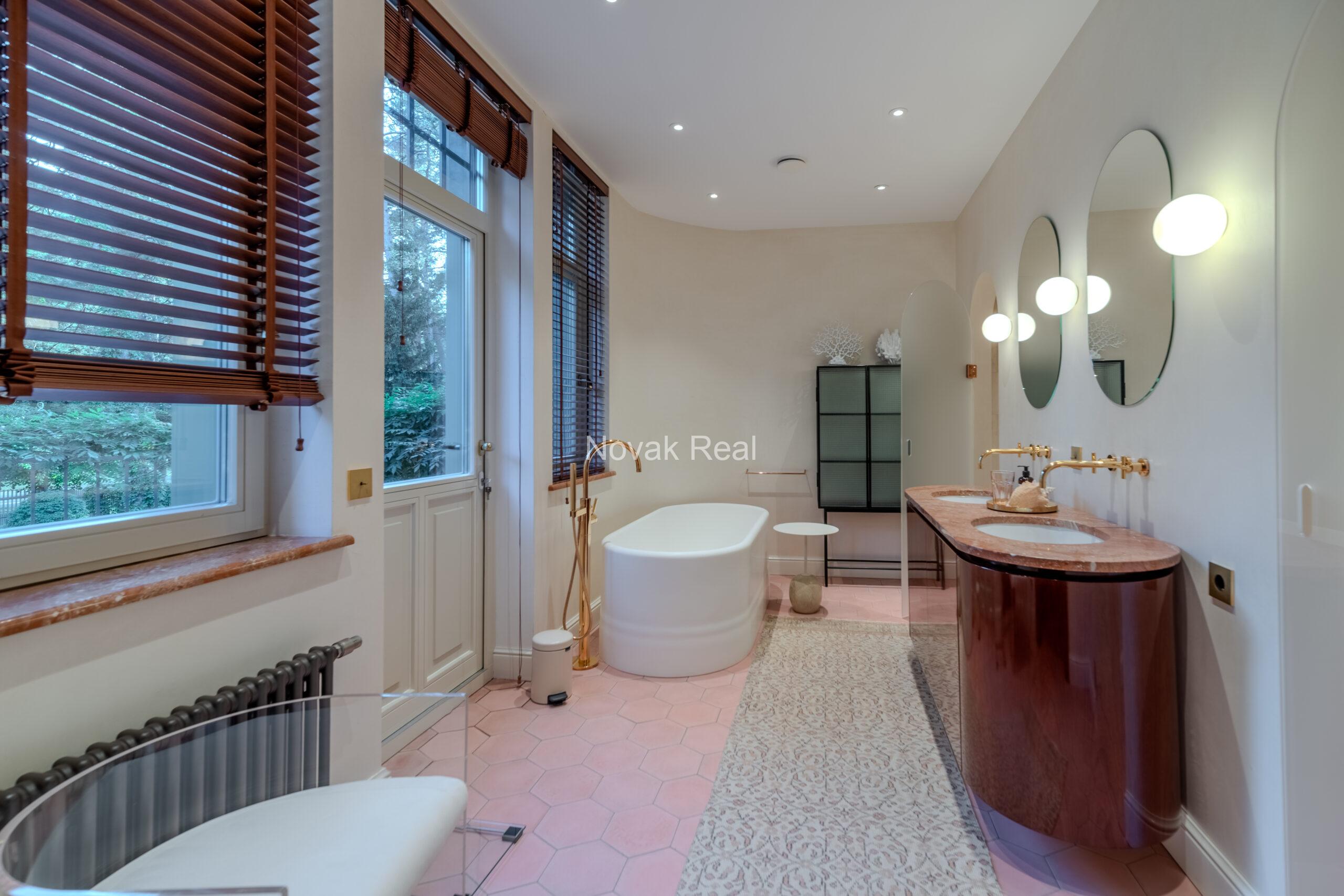 In Lielupe, close to the sea and a pine park, an elegant, renovated three-storey villa is offered for sale