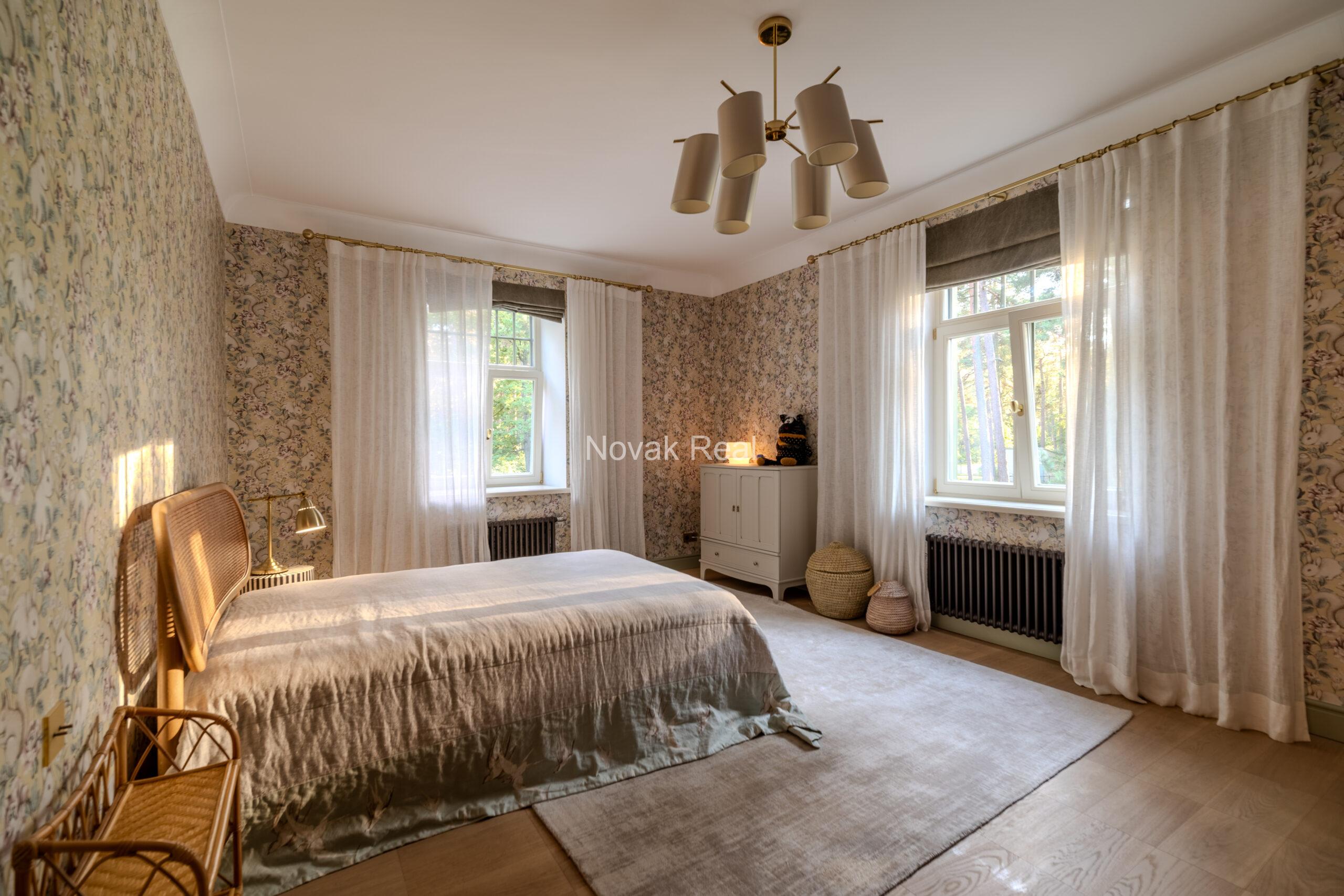 In Lielupe, close to the sea and a pine park, an elegant, renovated three-storey villa is offered for sale