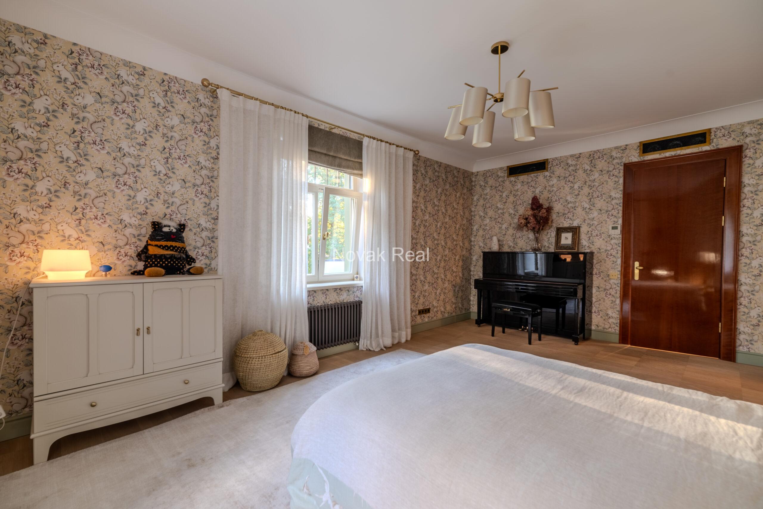 In Lielupe, close to the sea and a pine park, an elegant, renovated three-storey villa is offered for sale