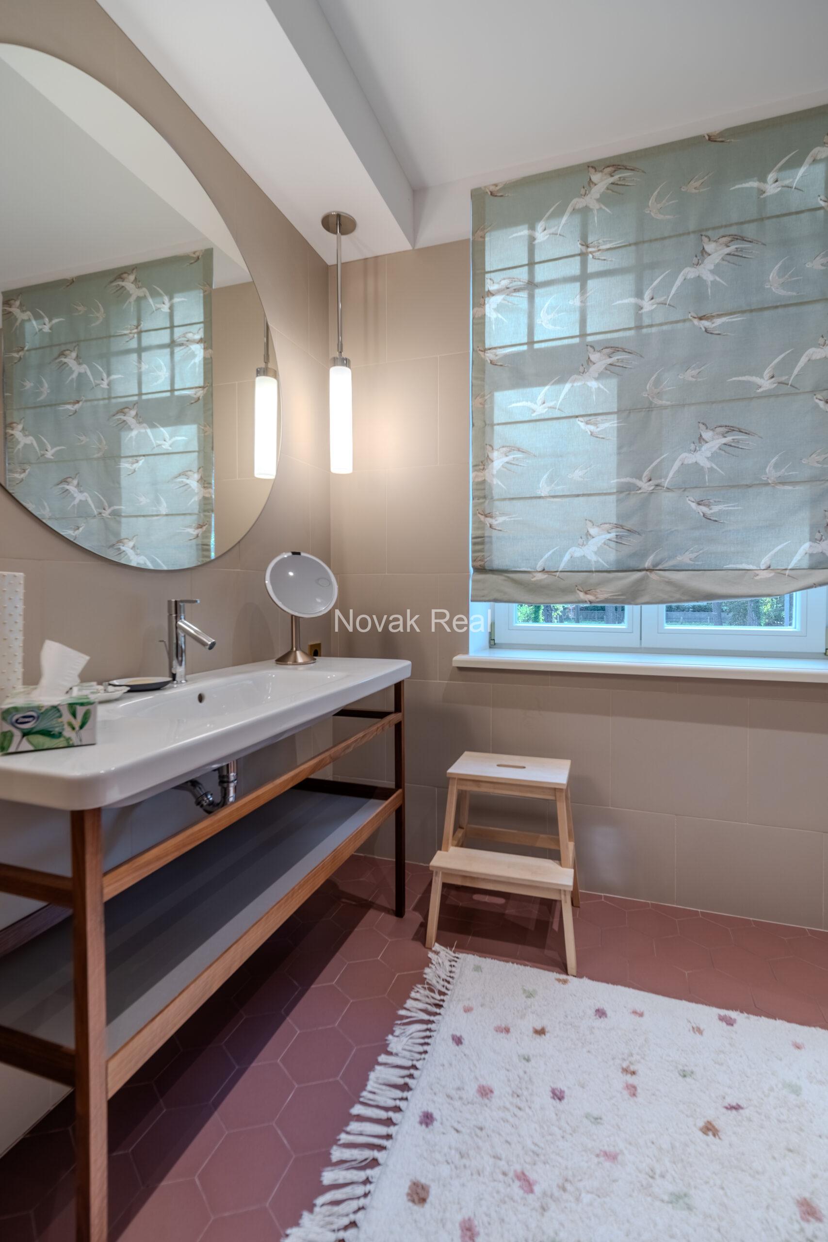 In Lielupe, close to the sea and a pine park, an elegant, renovated three-storey villa is offered for sale