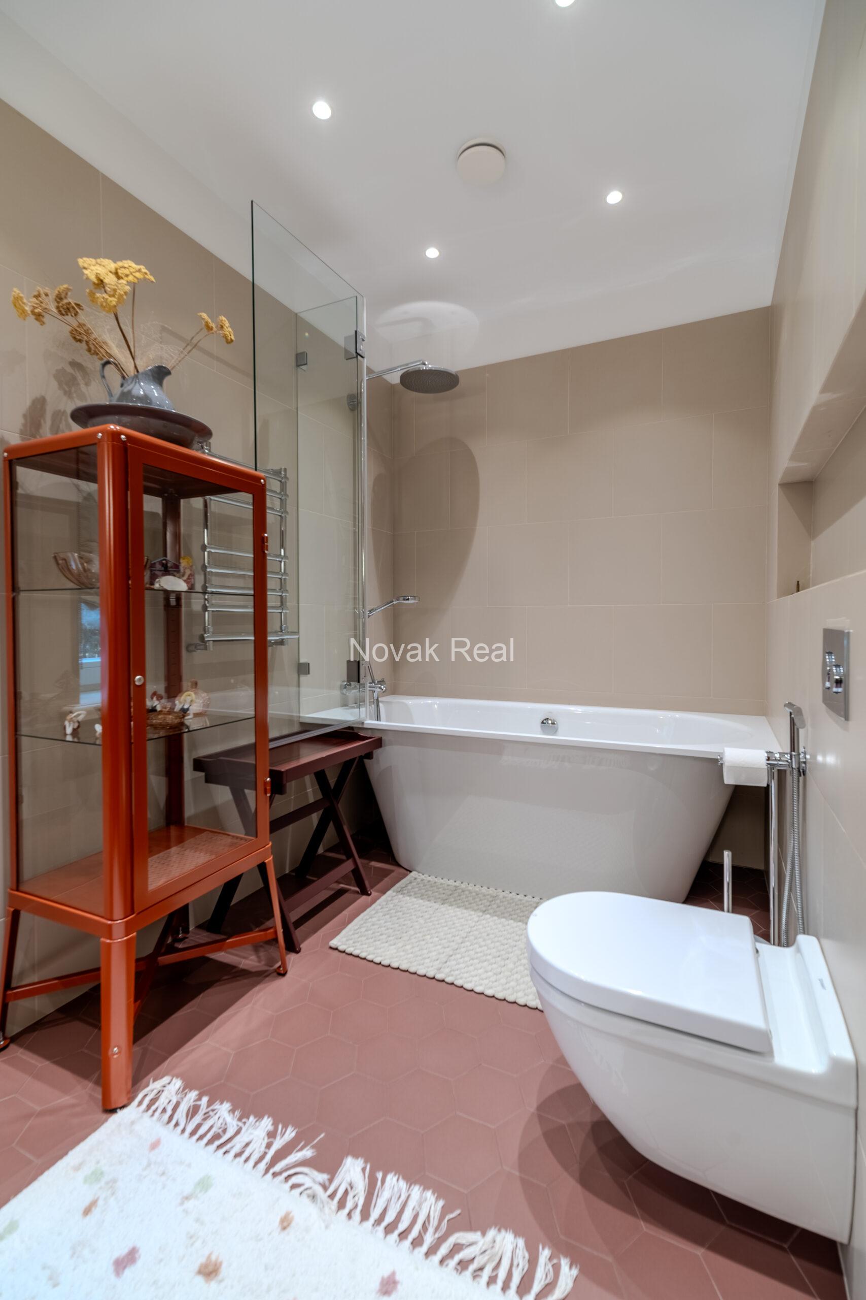 In Lielupe, close to the sea and a pine park, an elegant, renovated three-storey villa is offered for sale