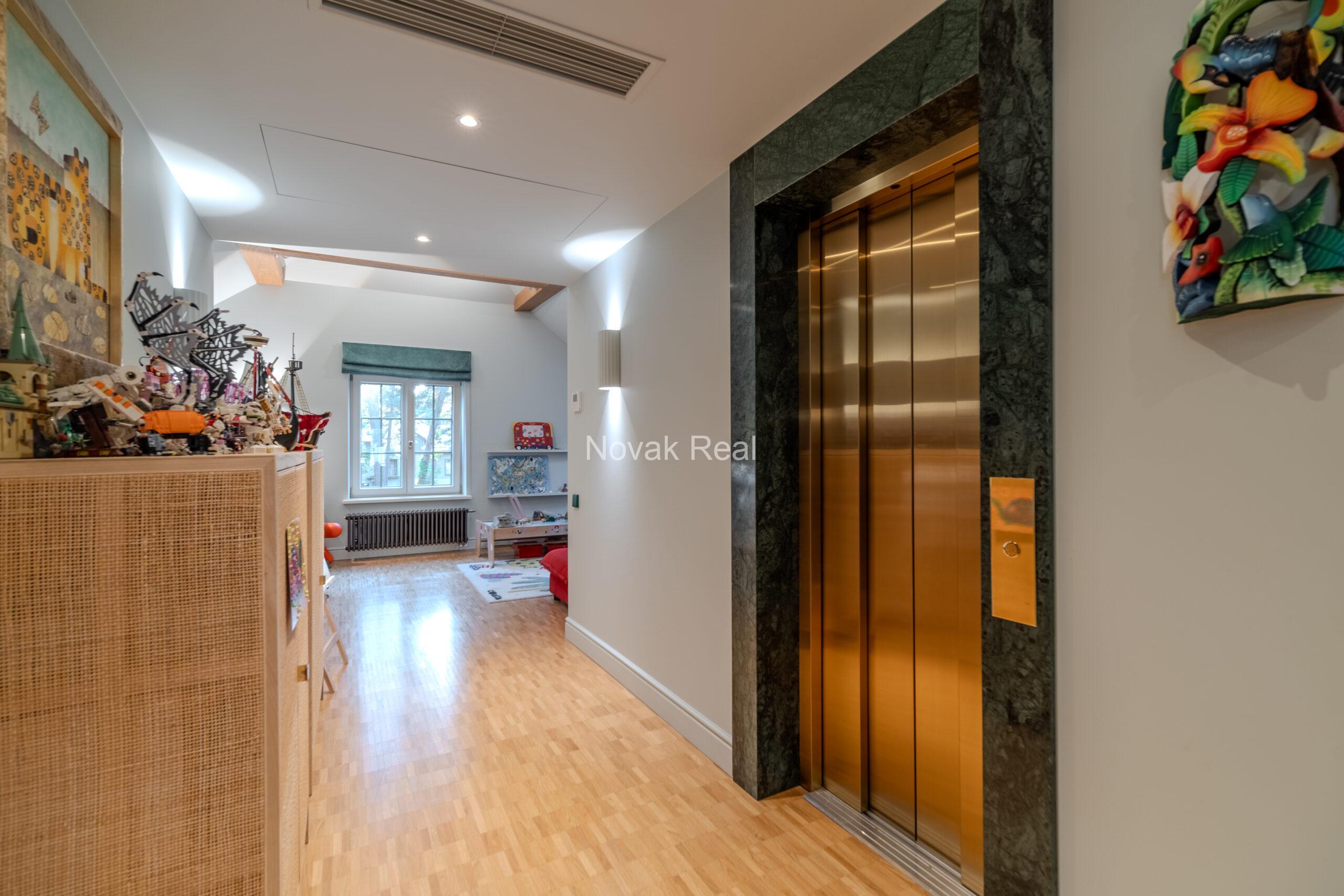 In Lielupe, close to the sea and a pine park, an elegant, renovated three-storey villa is offered for sale