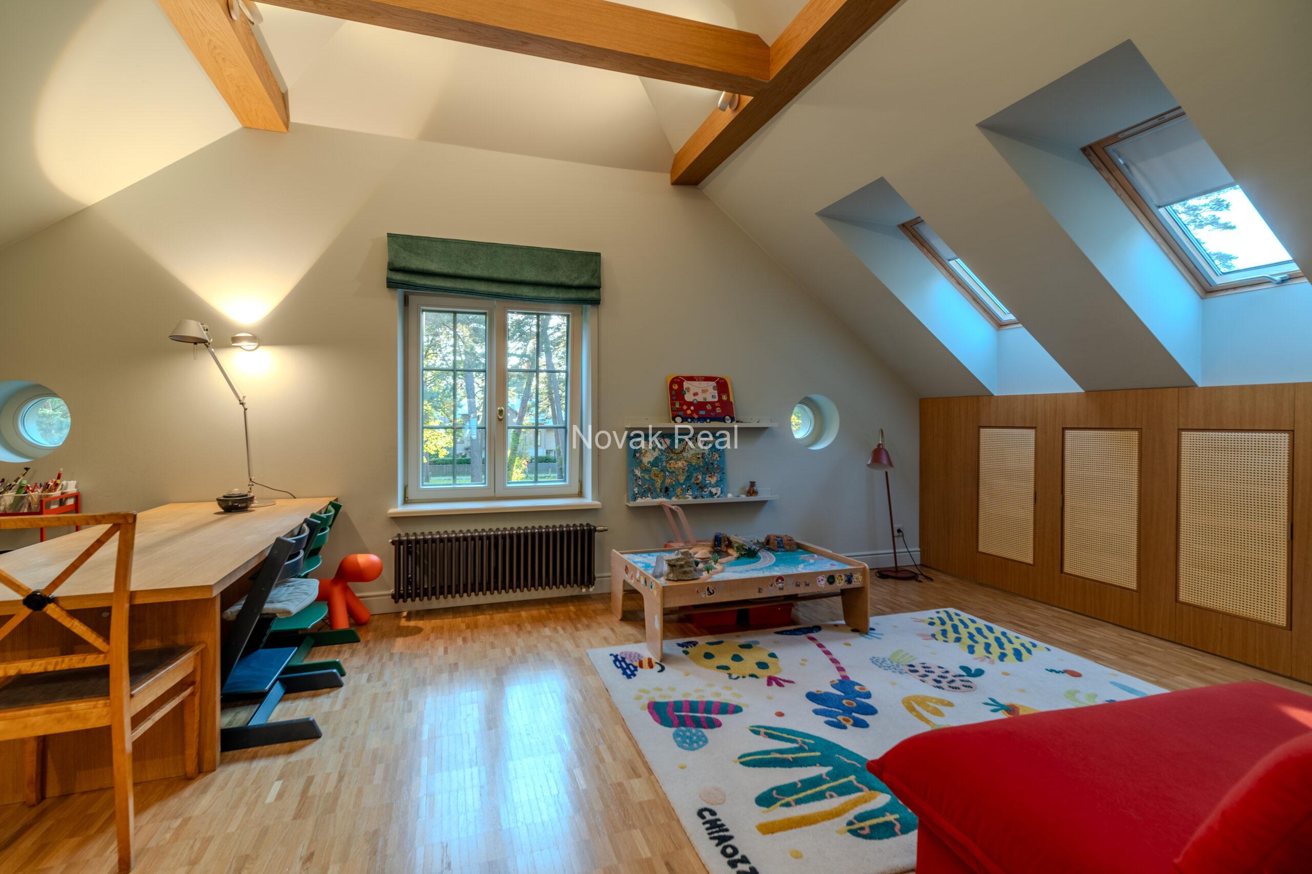 In Lielupe, close to the sea and a pine park, an elegant, renovated three-storey villa is offered for sale