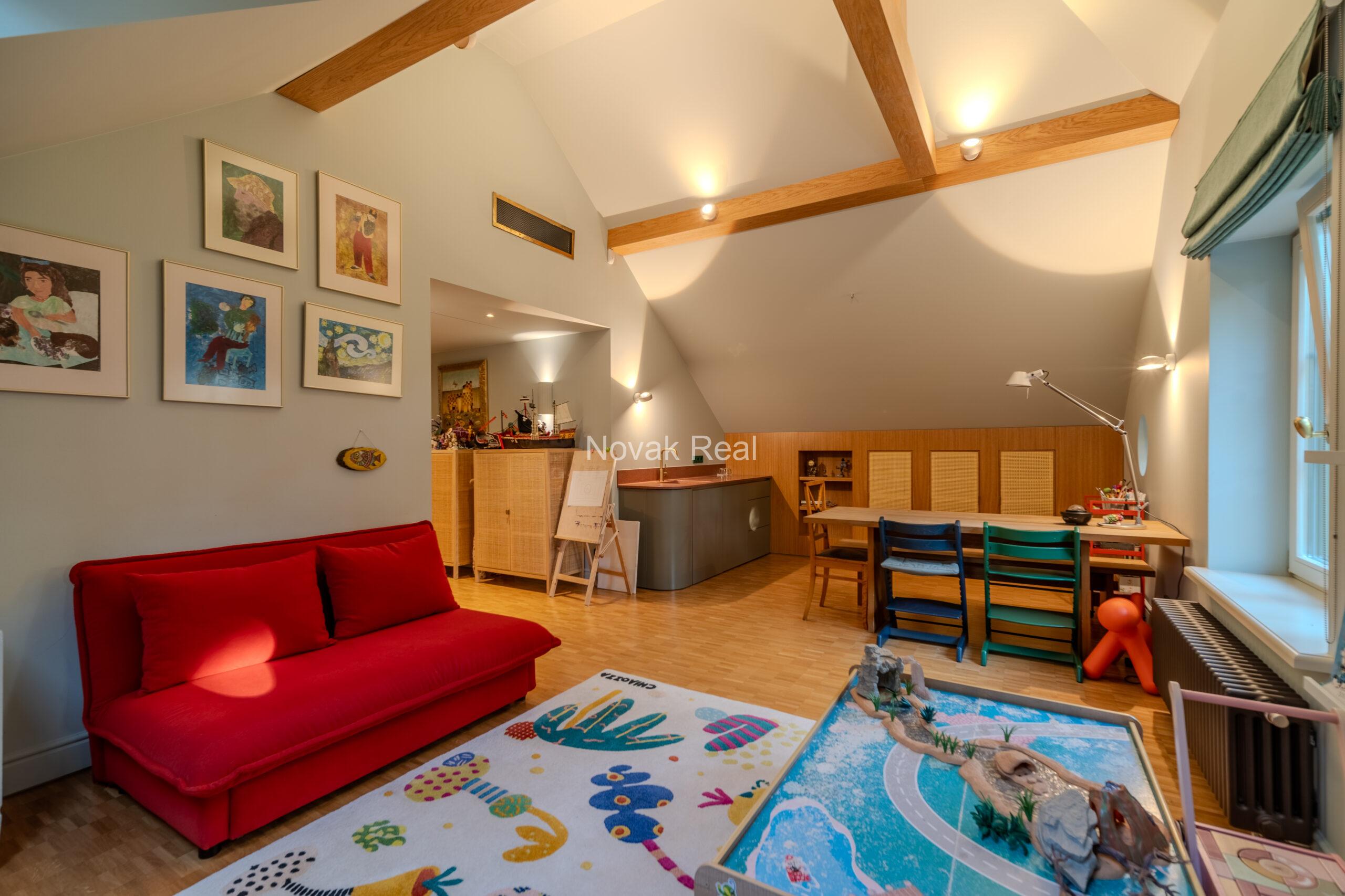In Lielupe, close to the sea and a pine park, an elegant, renovated three-storey villa is offered for sale