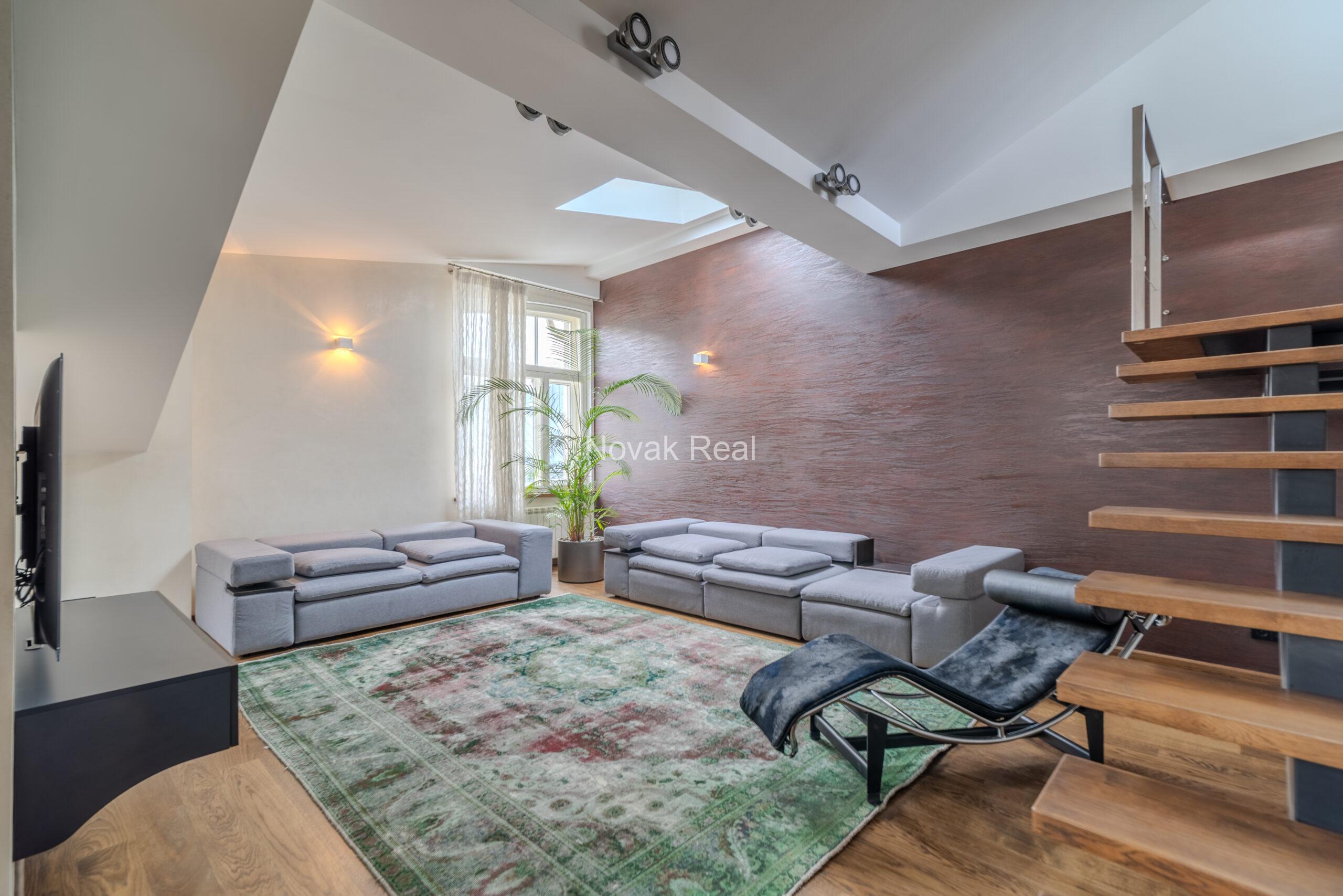 A spacious five-room attic apartment is offered for sale in the Quiet Centre of Riga