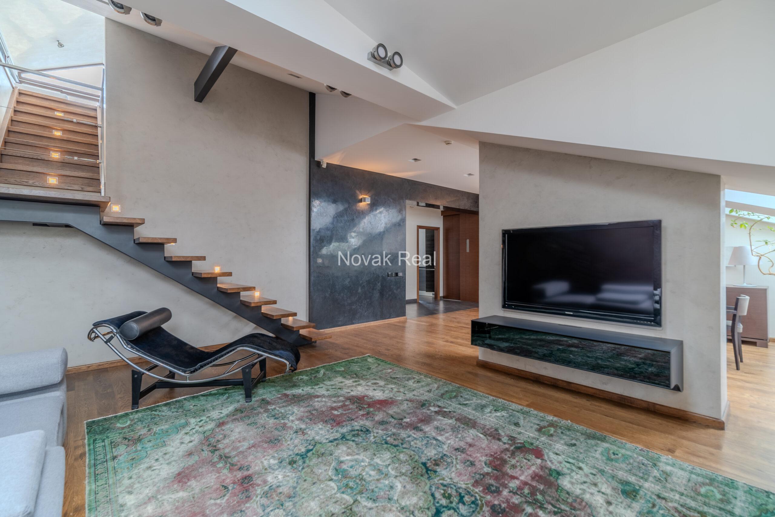 A spacious five-room attic apartment is offered for sale in the Quiet Centre of Riga