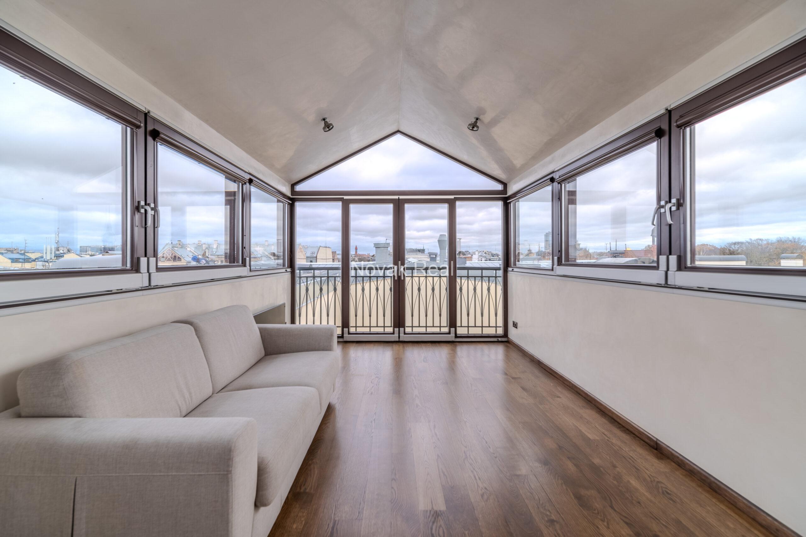 A spacious five-room attic apartment is offered for sale in the Quiet Centre of Riga