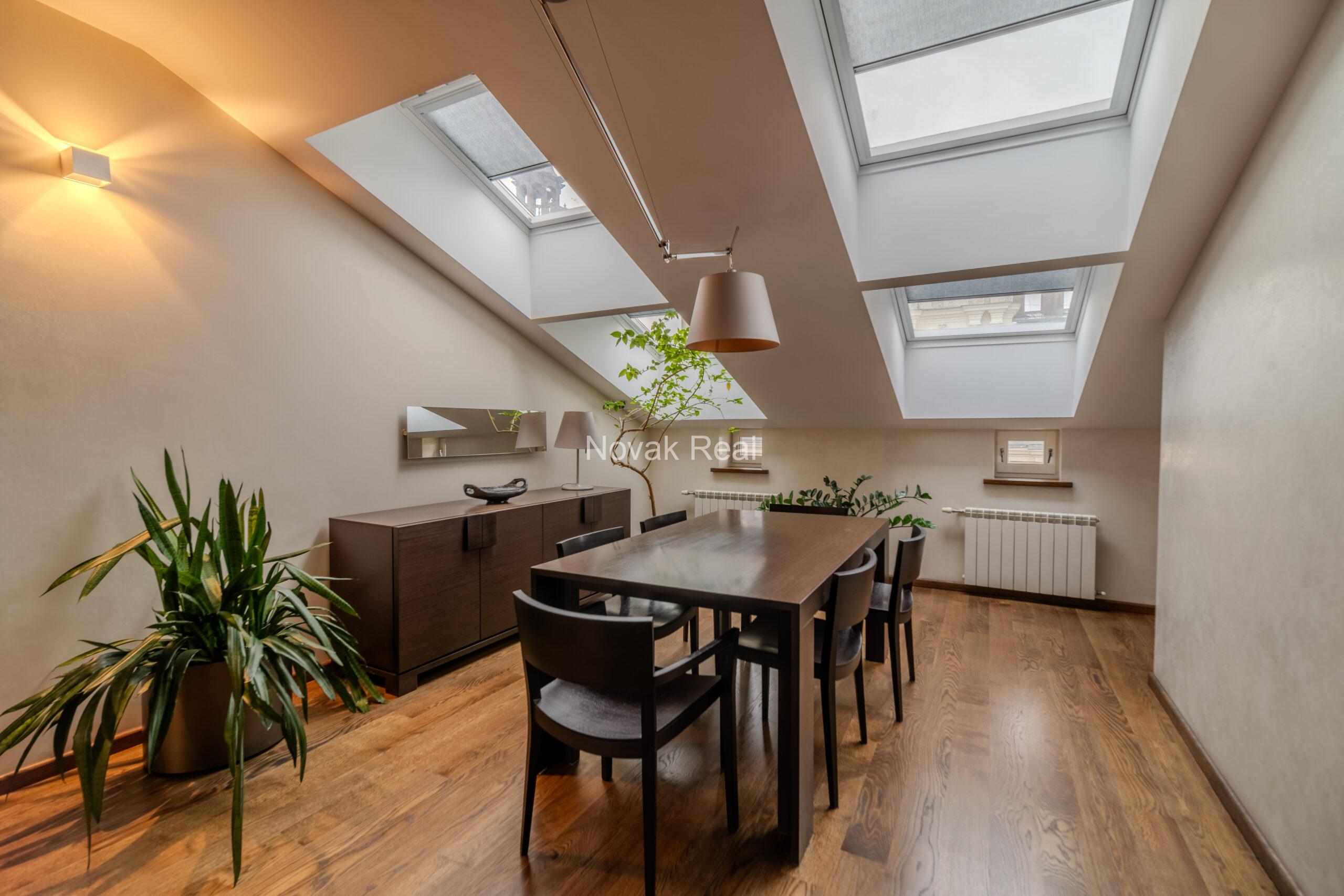 A spacious five-room attic apartment is offered for sale in the Quiet Centre of Riga