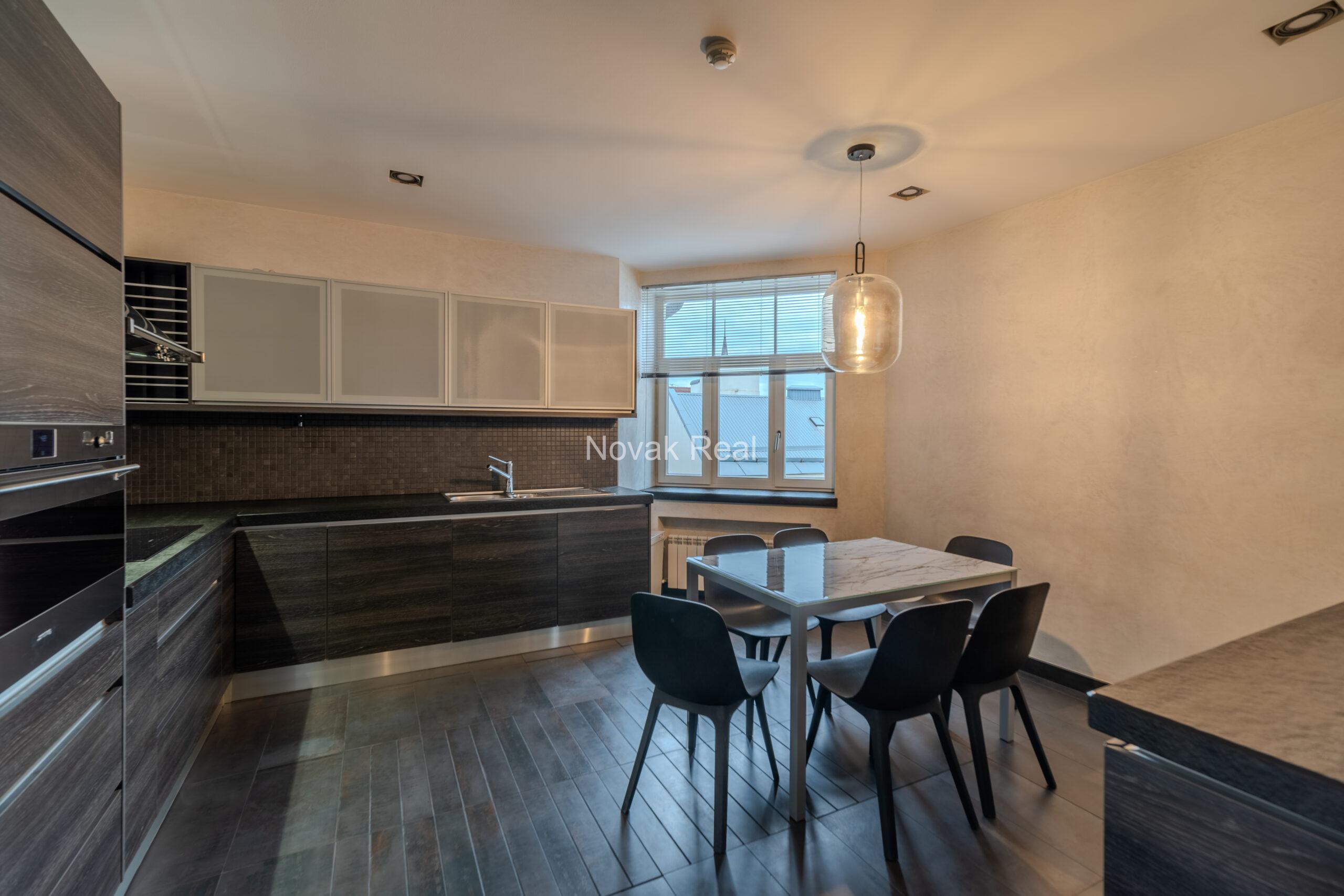 A spacious five-room attic apartment is offered for sale in the Quiet Centre of Riga