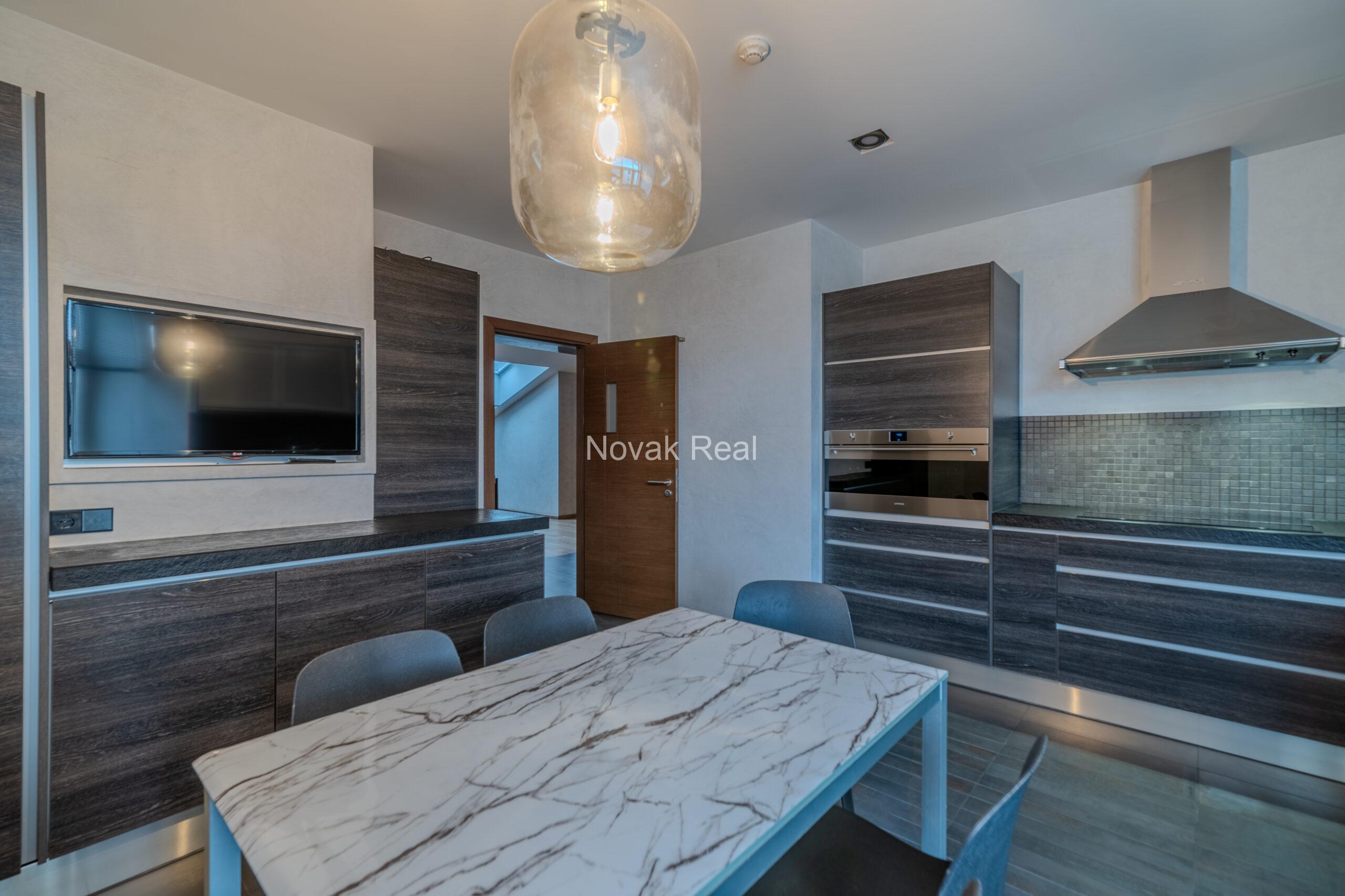 A spacious five-room attic apartment is offered for sale in the Quiet Centre of Riga