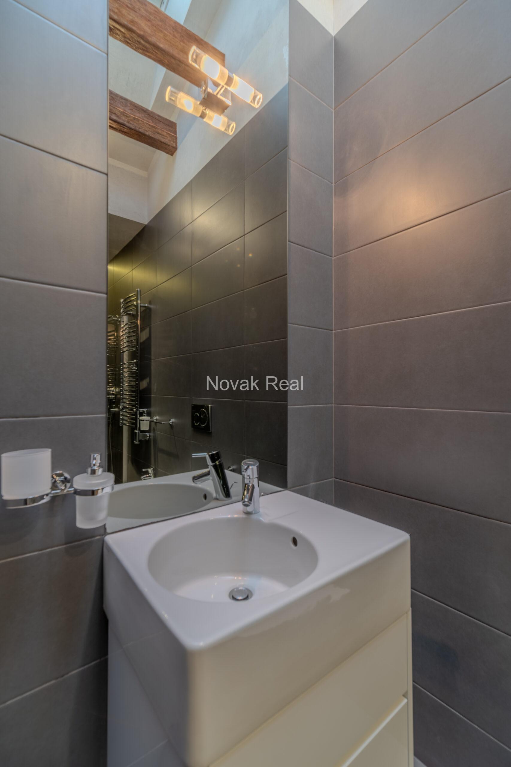 A spacious five-room attic apartment is offered for sale in the Quiet Centre of Riga