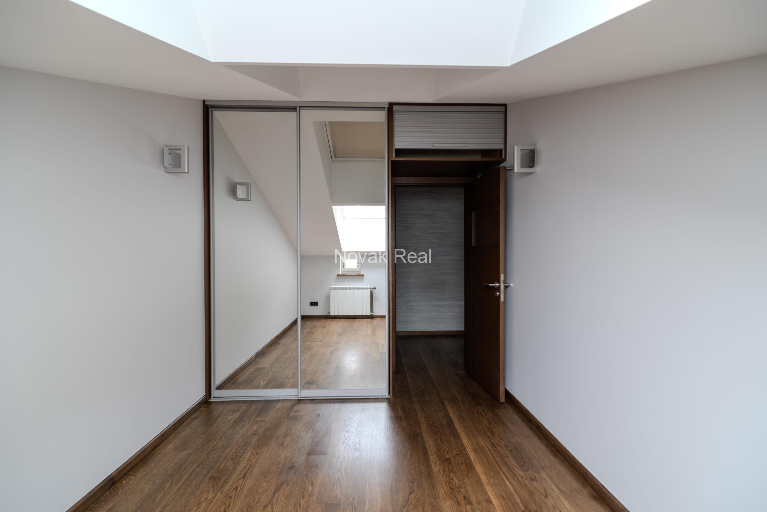 A spacious five-room attic apartment is offered for sale in the Quiet Centre of Riga