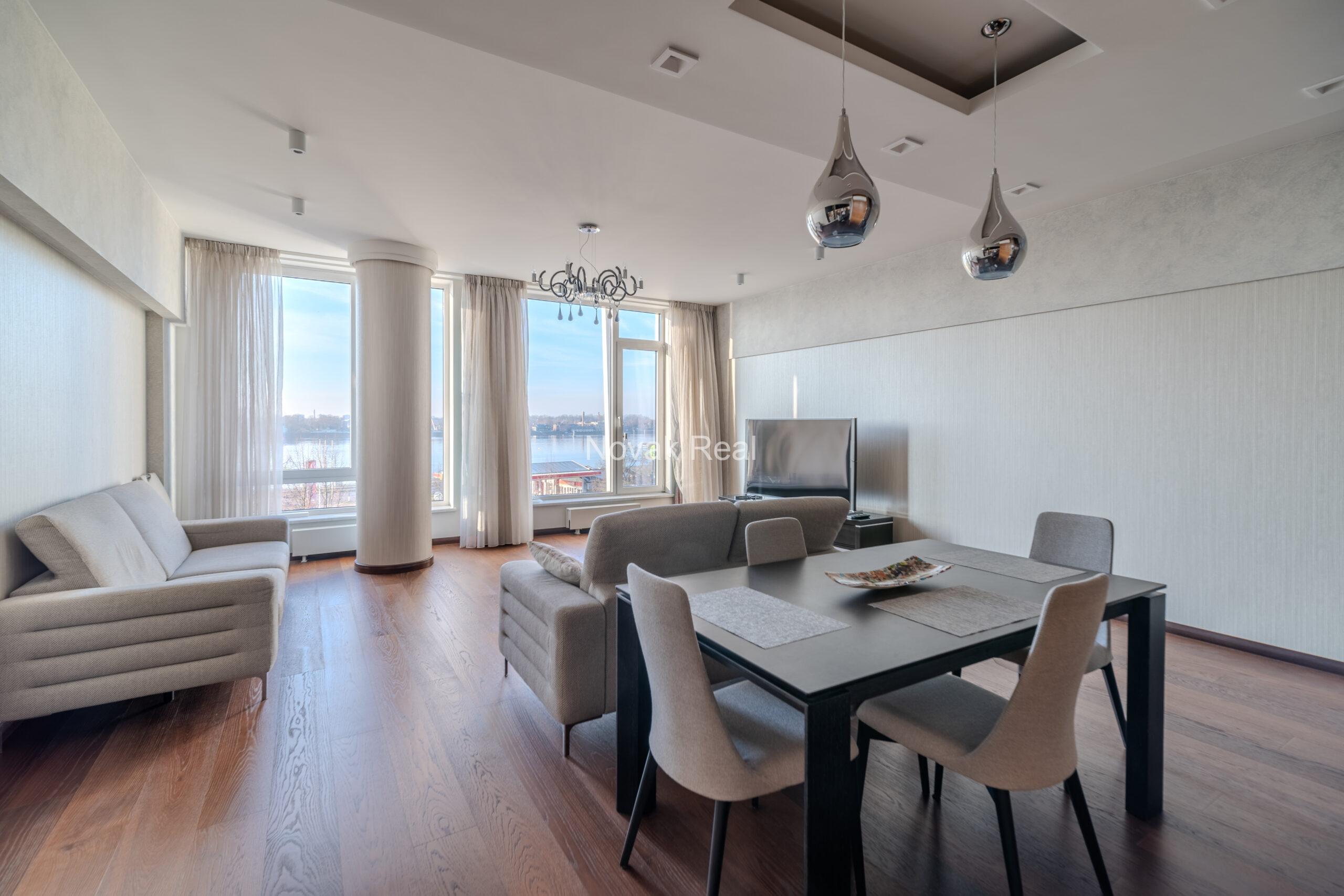 A three-room apartment is offered for sale in the city center with a river view