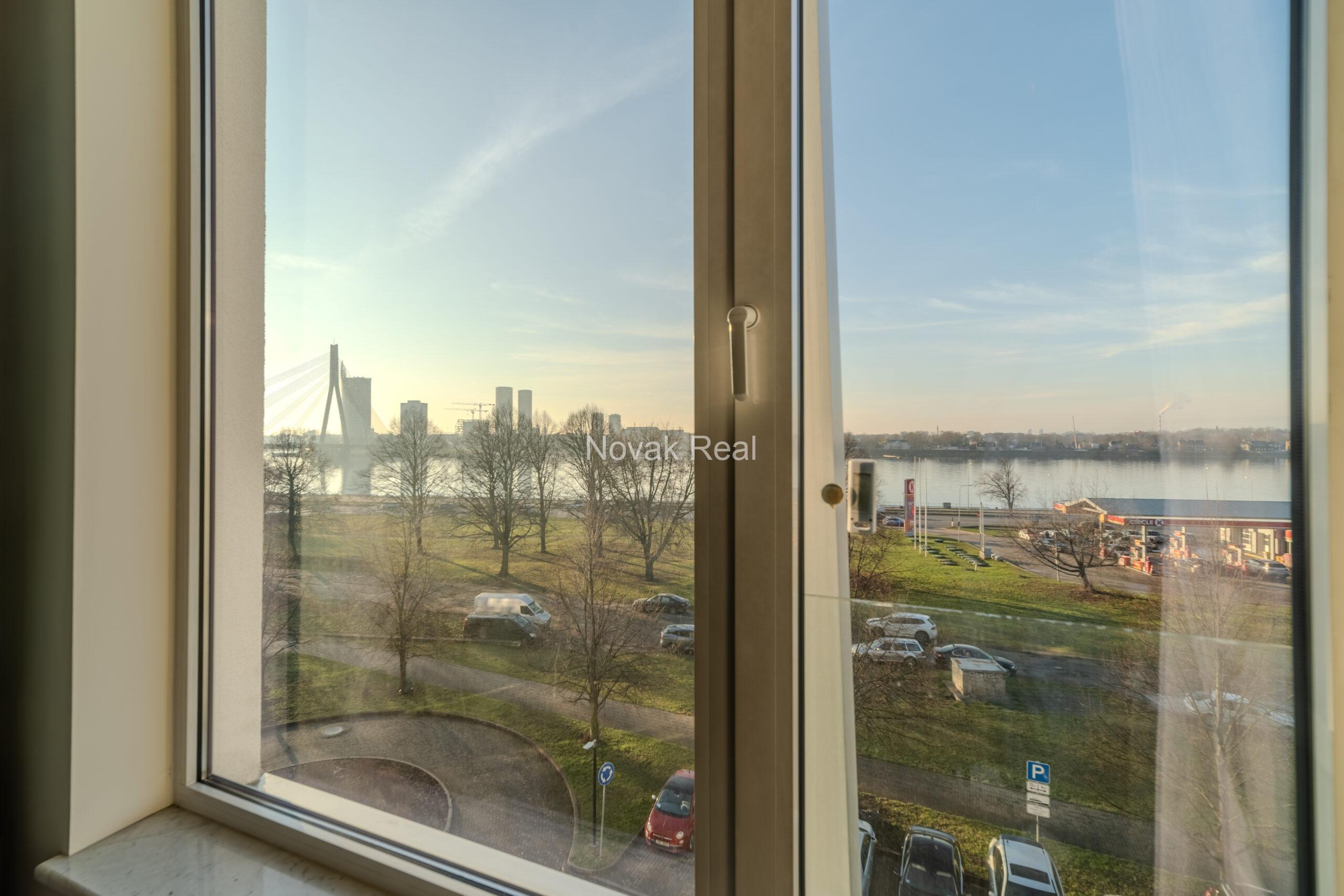 A three-room apartment is offered for sale in the city center with a river view