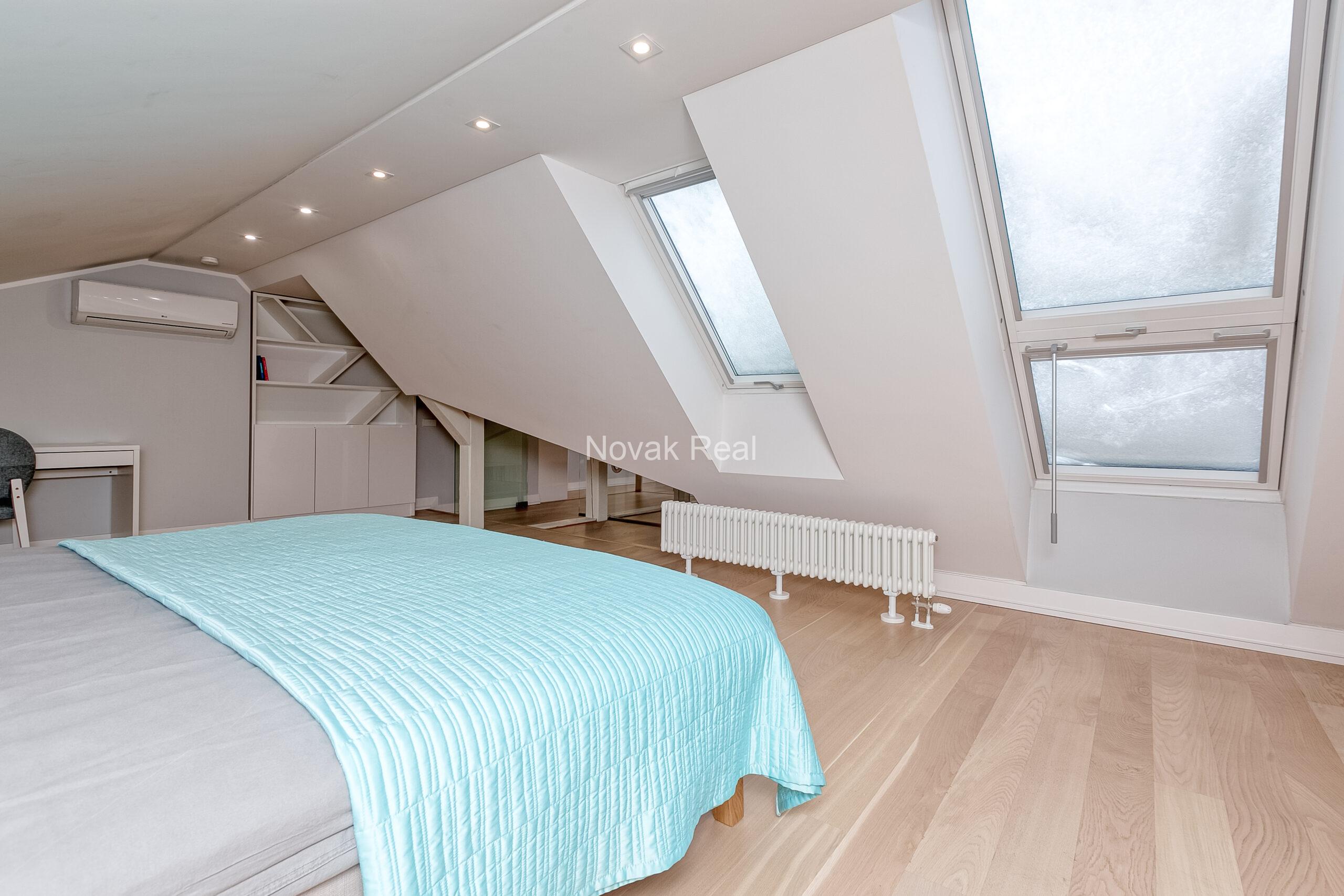 A duplex apartment is offered in the historic Résidence Lumière building