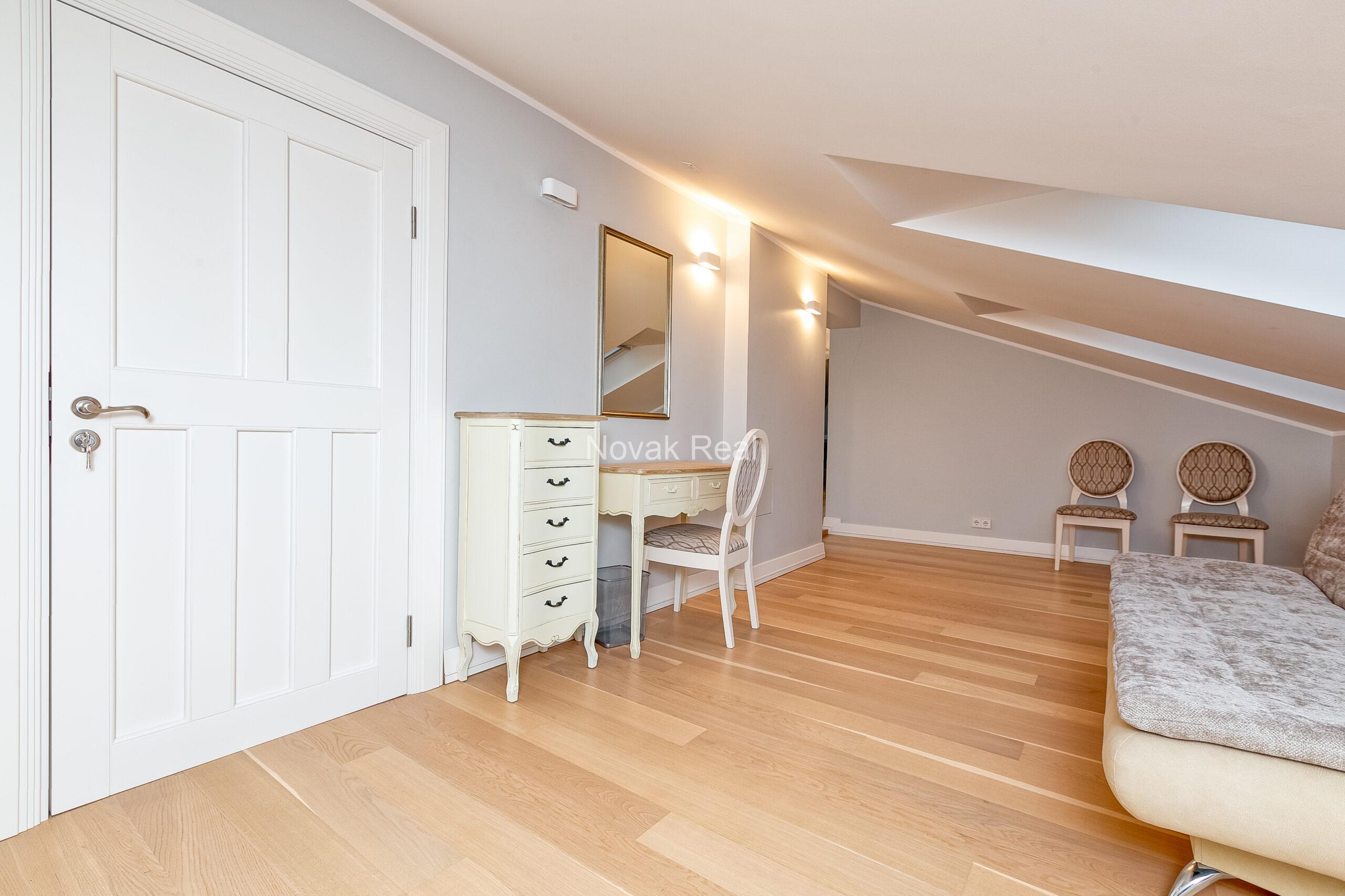 A duplex apartment is offered in the historic Résidence Lumière building