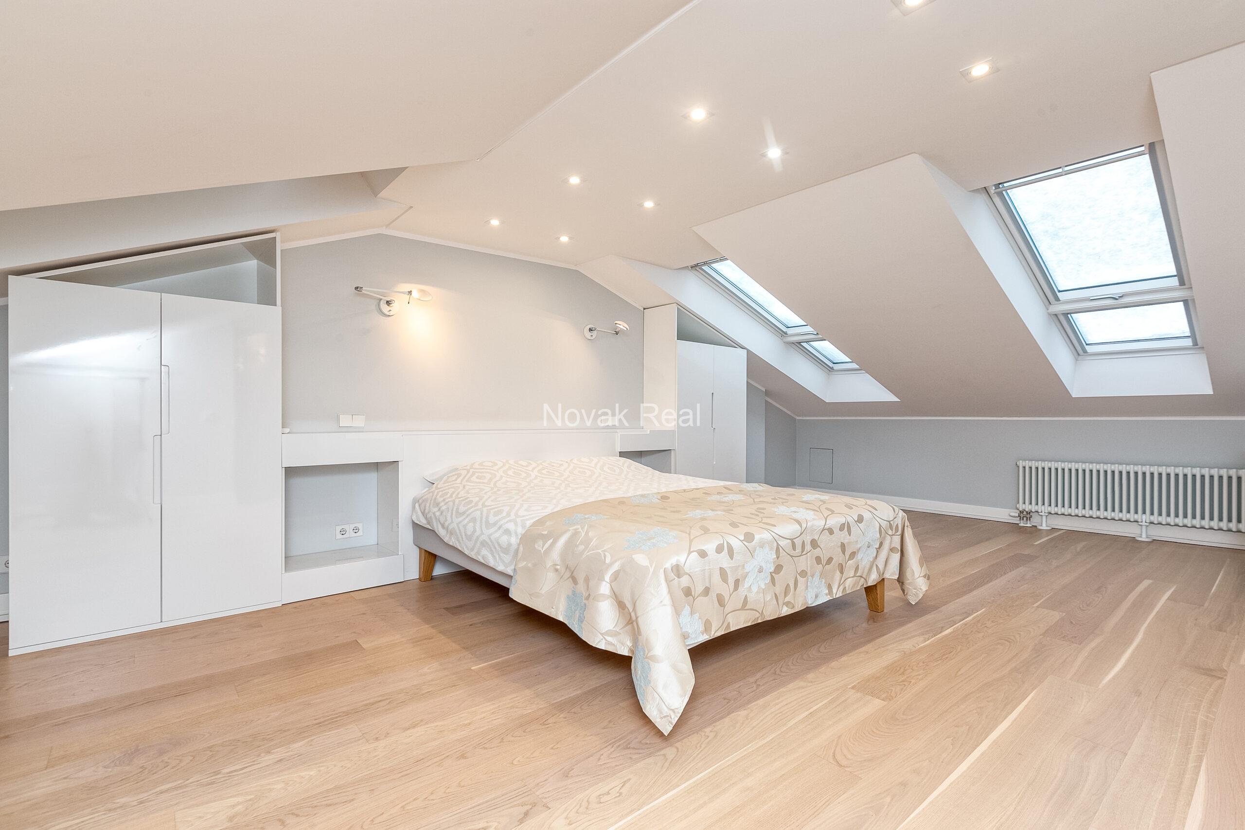 A duplex apartment is offered in the historic Résidence Lumière building