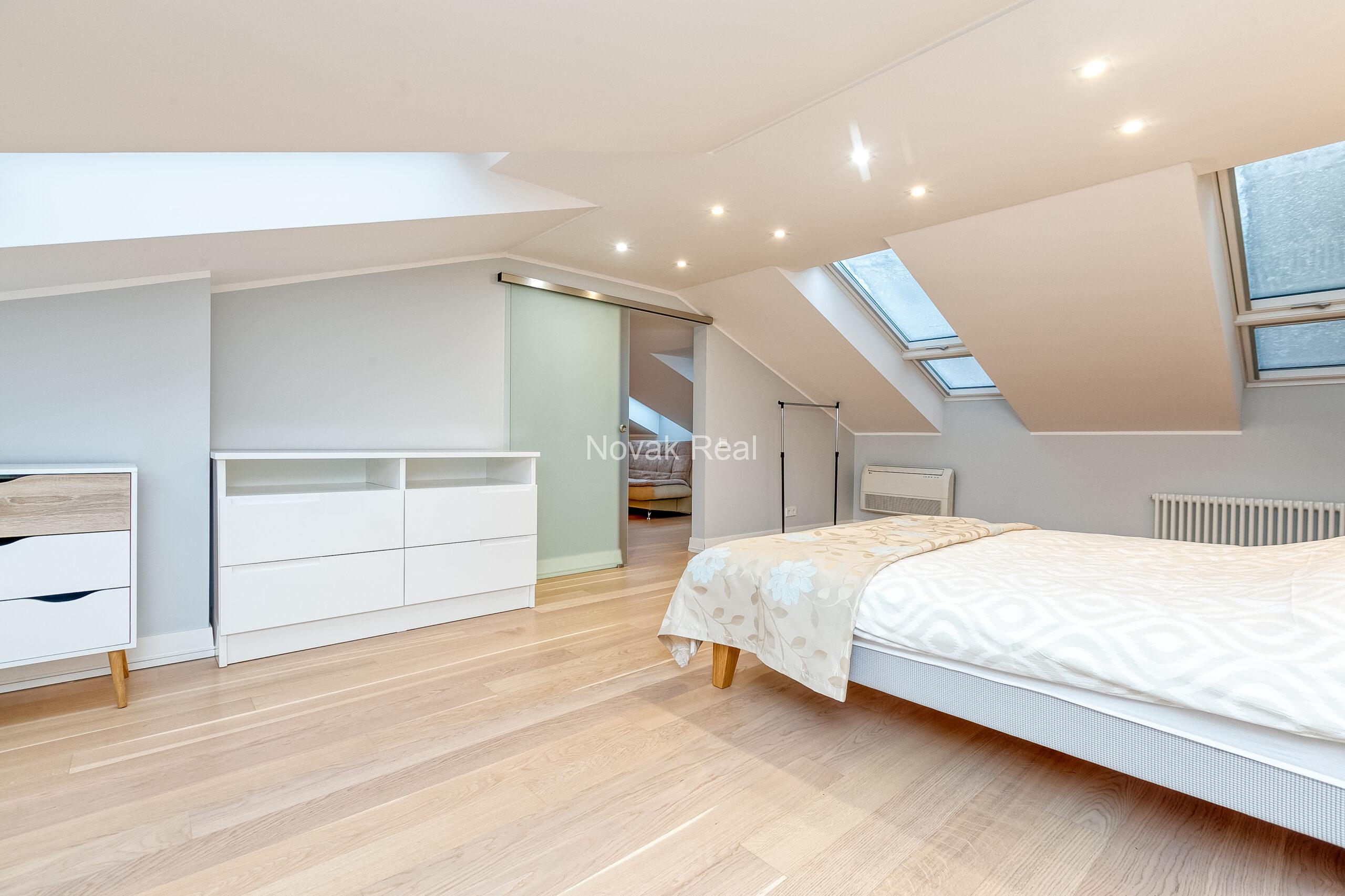 A duplex apartment is offered in the historic Résidence Lumière building