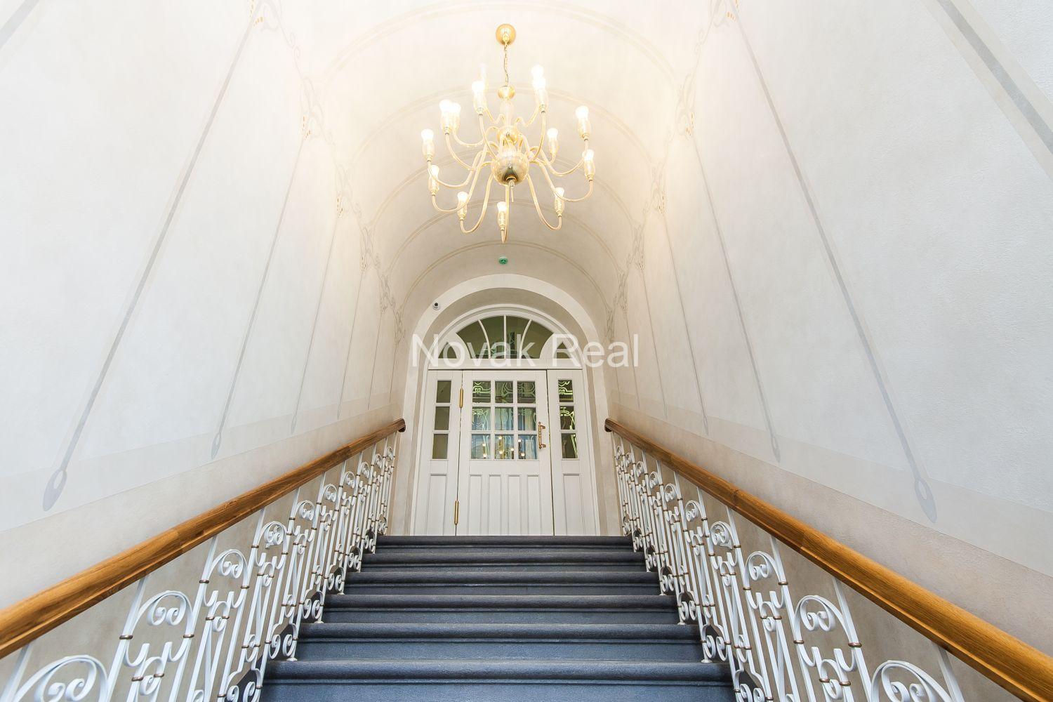 A duplex apartment is offered in the historic Résidence Lumière building