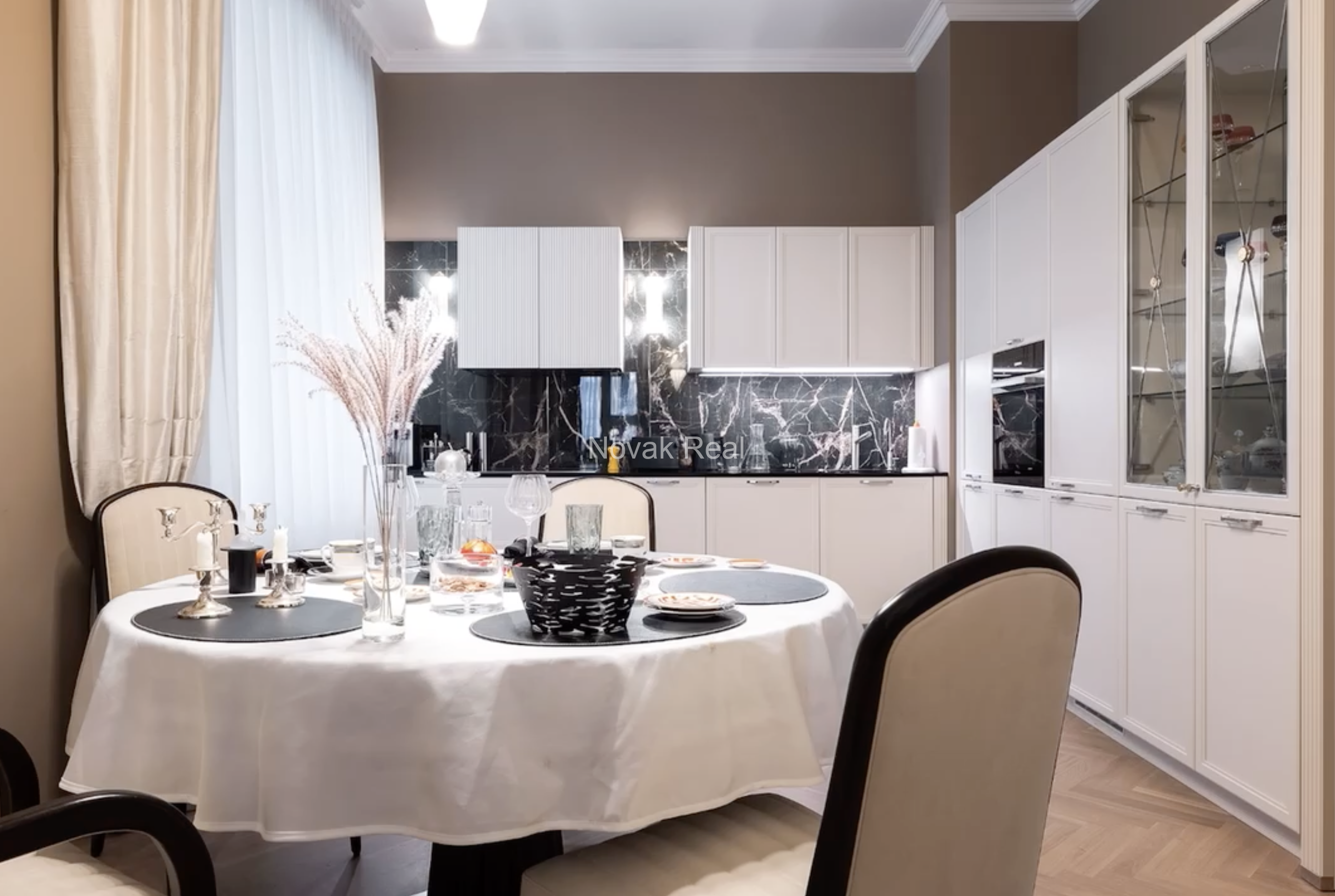 An elegant apartment is offered for sale in a fully renovated building