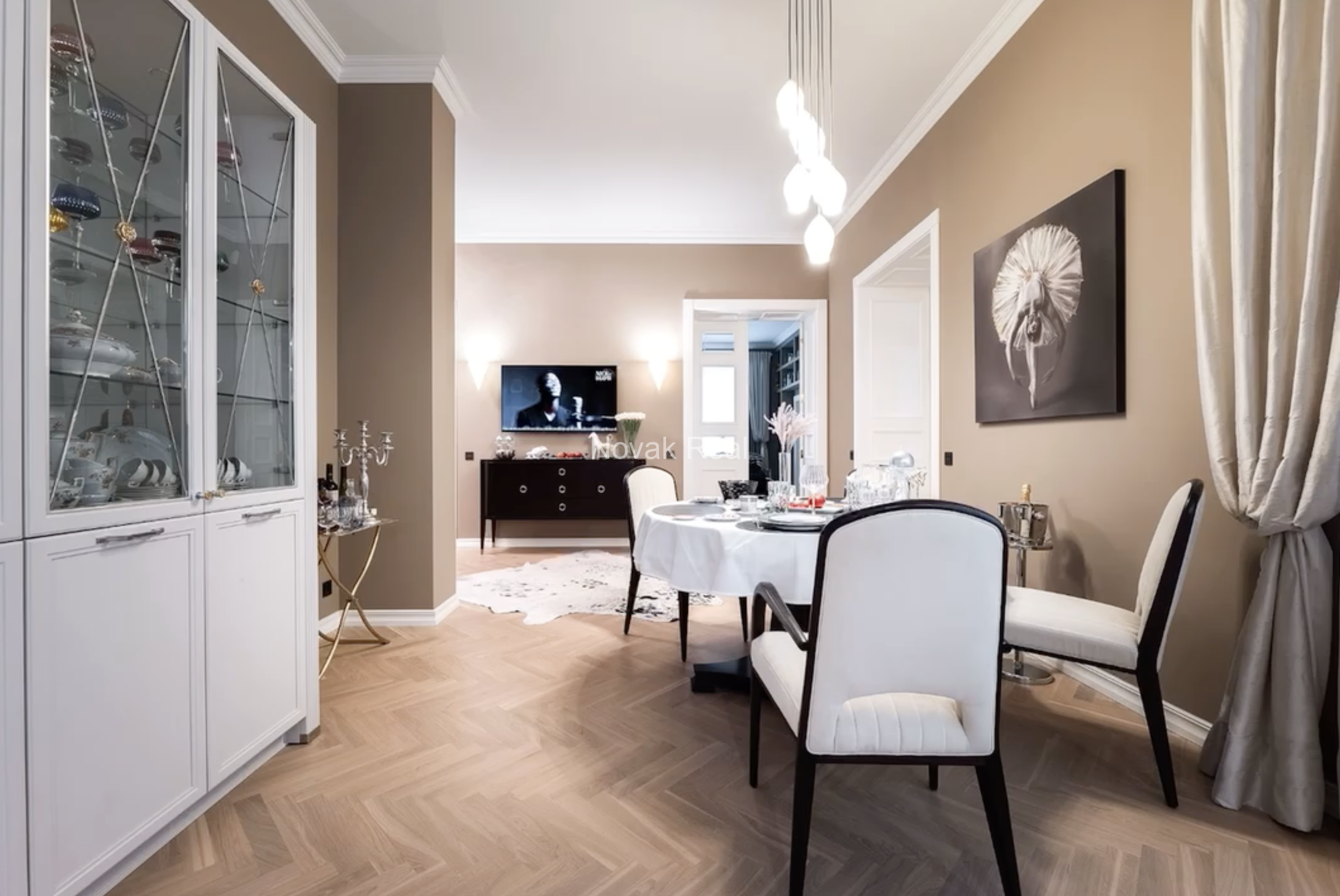 An elegant apartment is offered for sale in a fully renovated building