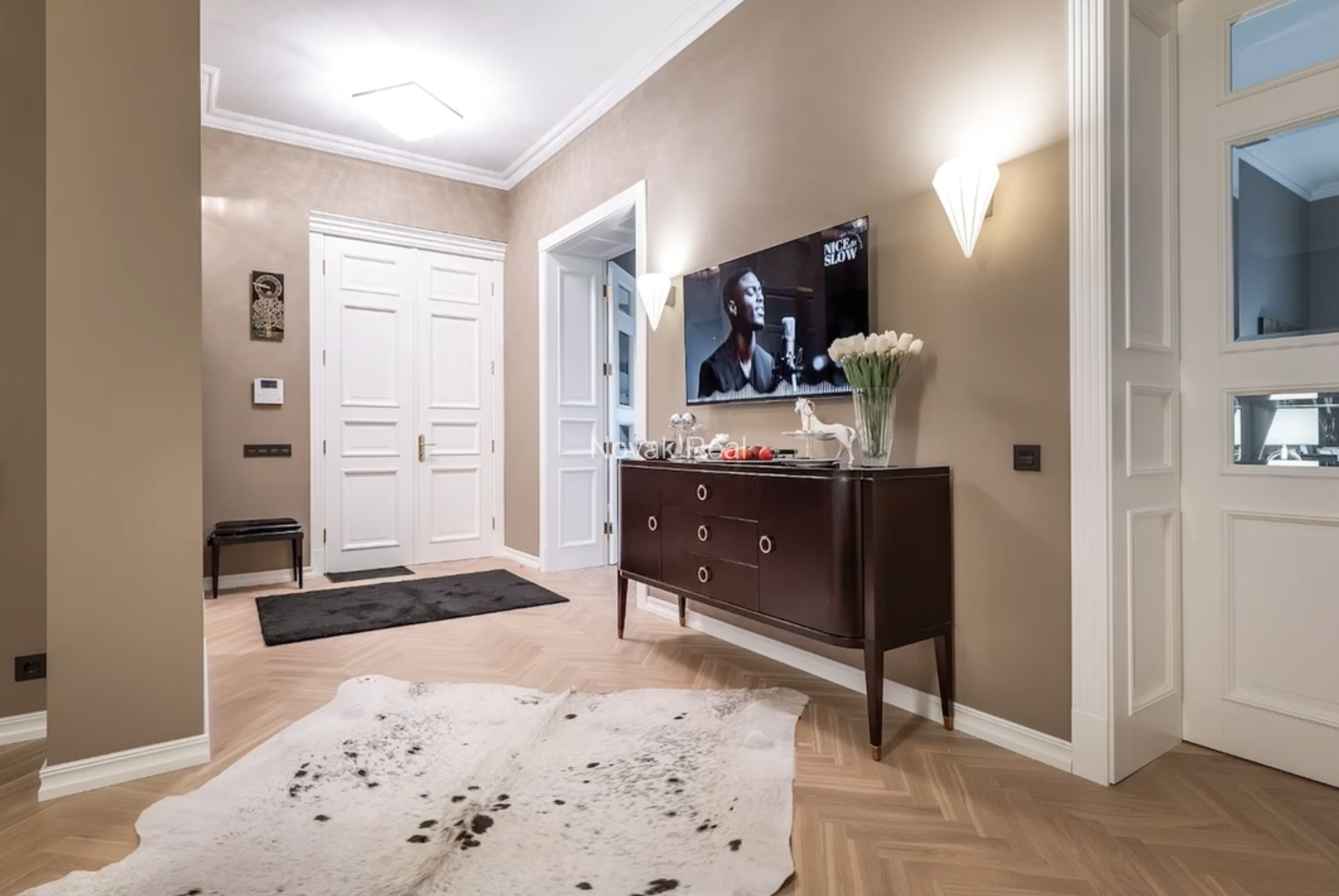 An elegant apartment is offered for sale in a fully renovated building