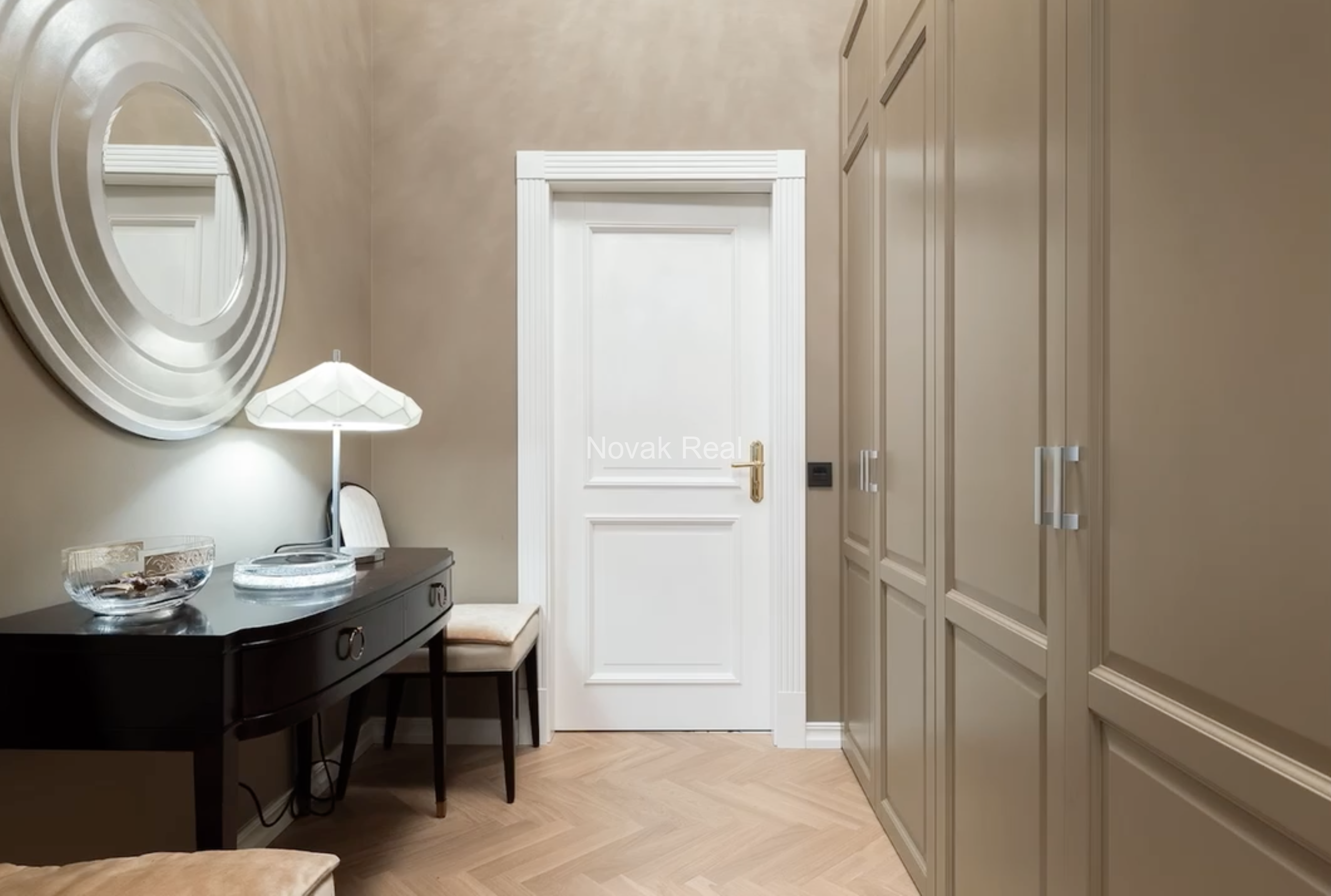 An elegant apartment is offered for sale in a fully renovated building