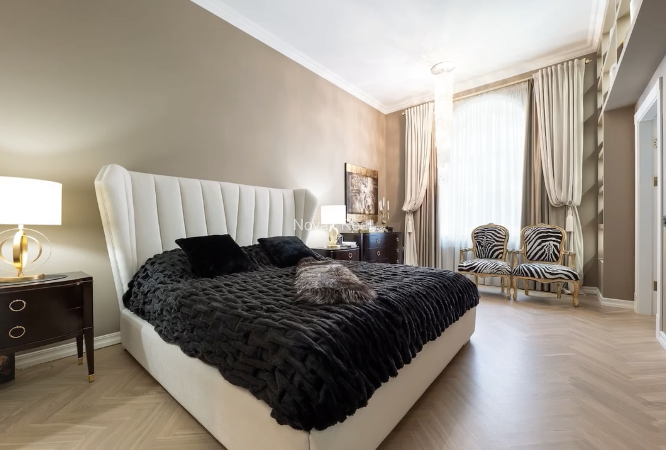 An elegant apartment is offered for sale in a fully renovated building