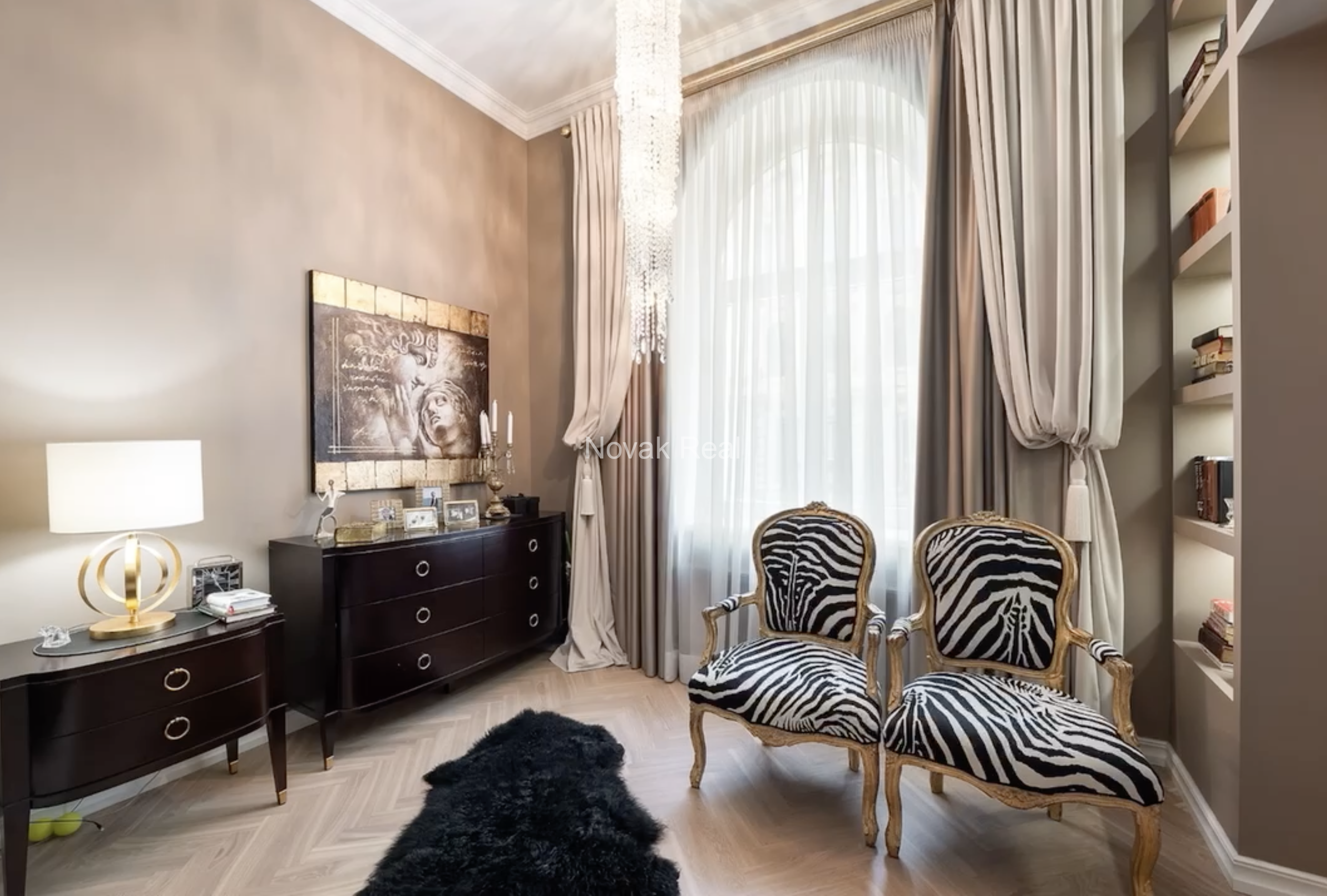 An elegant apartment is offered for sale in a fully renovated building