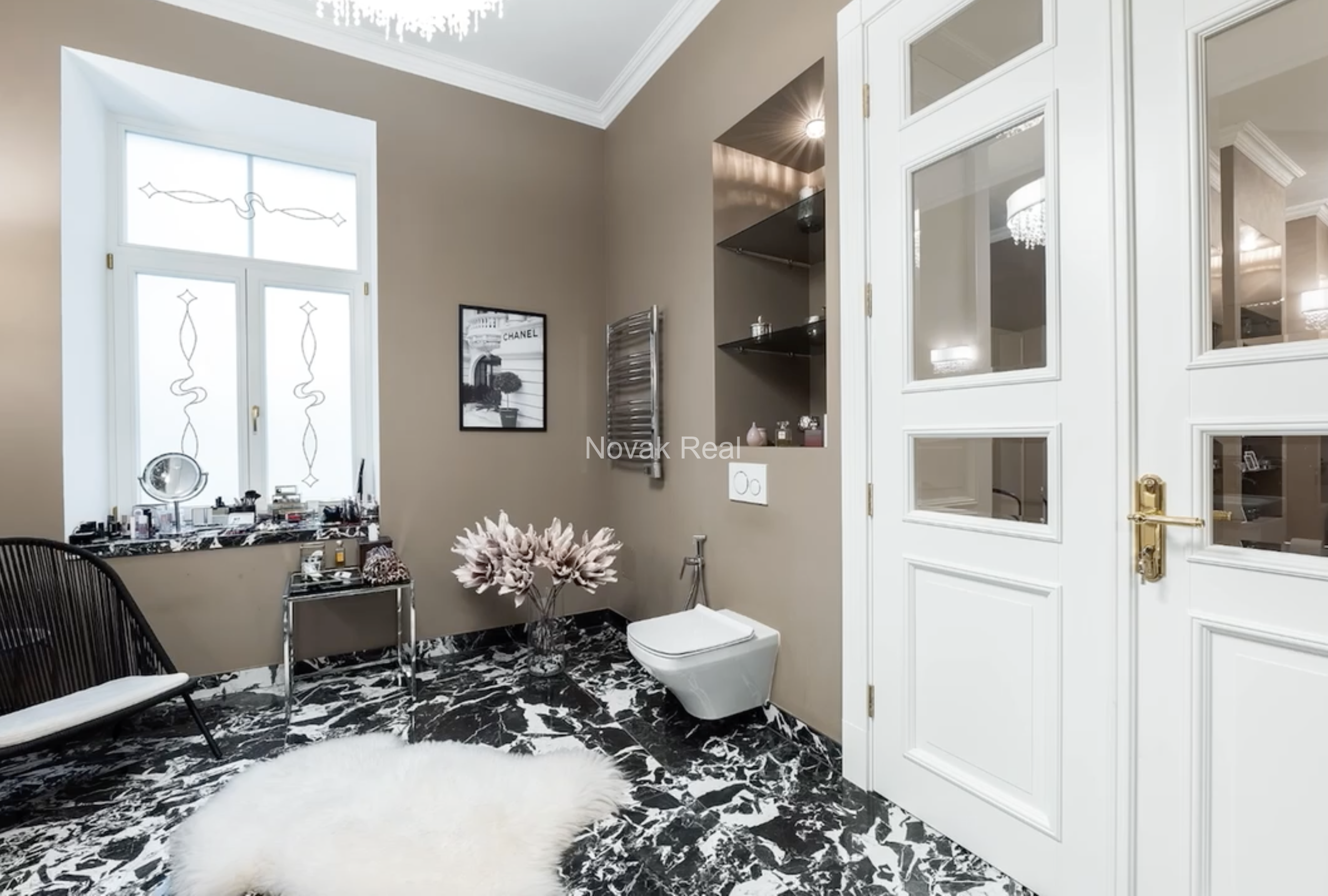 An elegant apartment is offered for sale in a fully renovated building