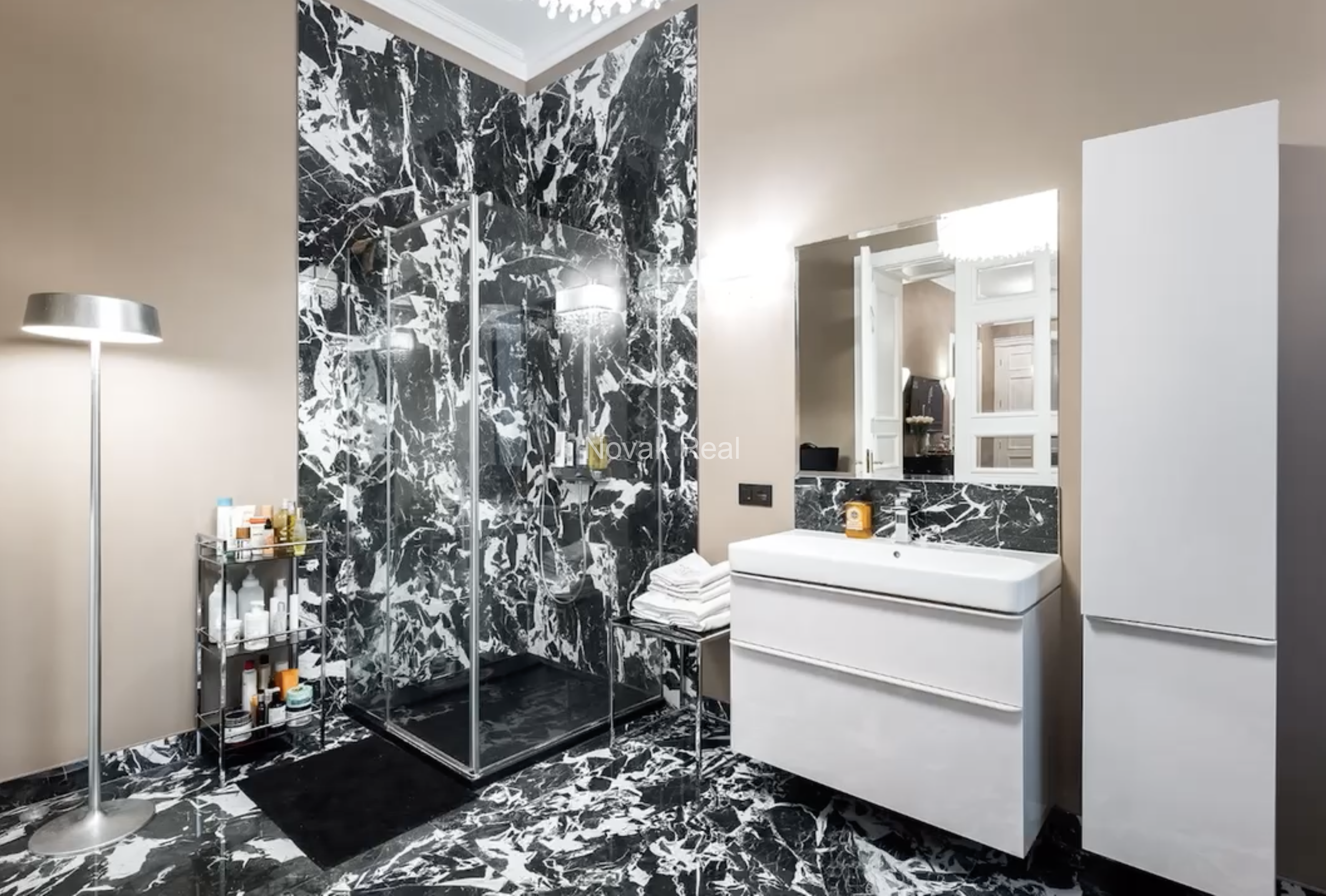 An elegant apartment is offered for sale in a fully renovated building