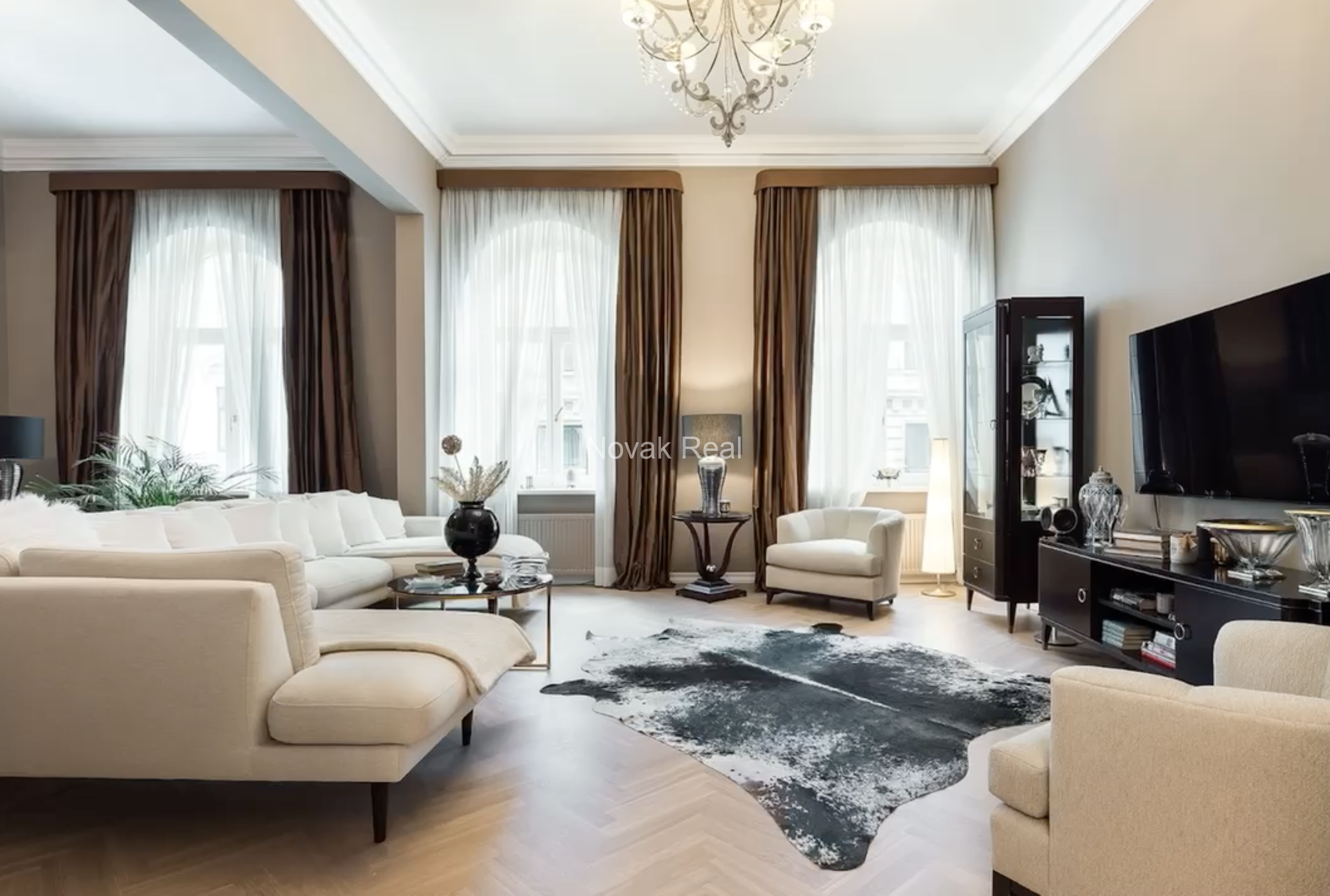 An elegant apartment is offered for sale in a fully renovated building